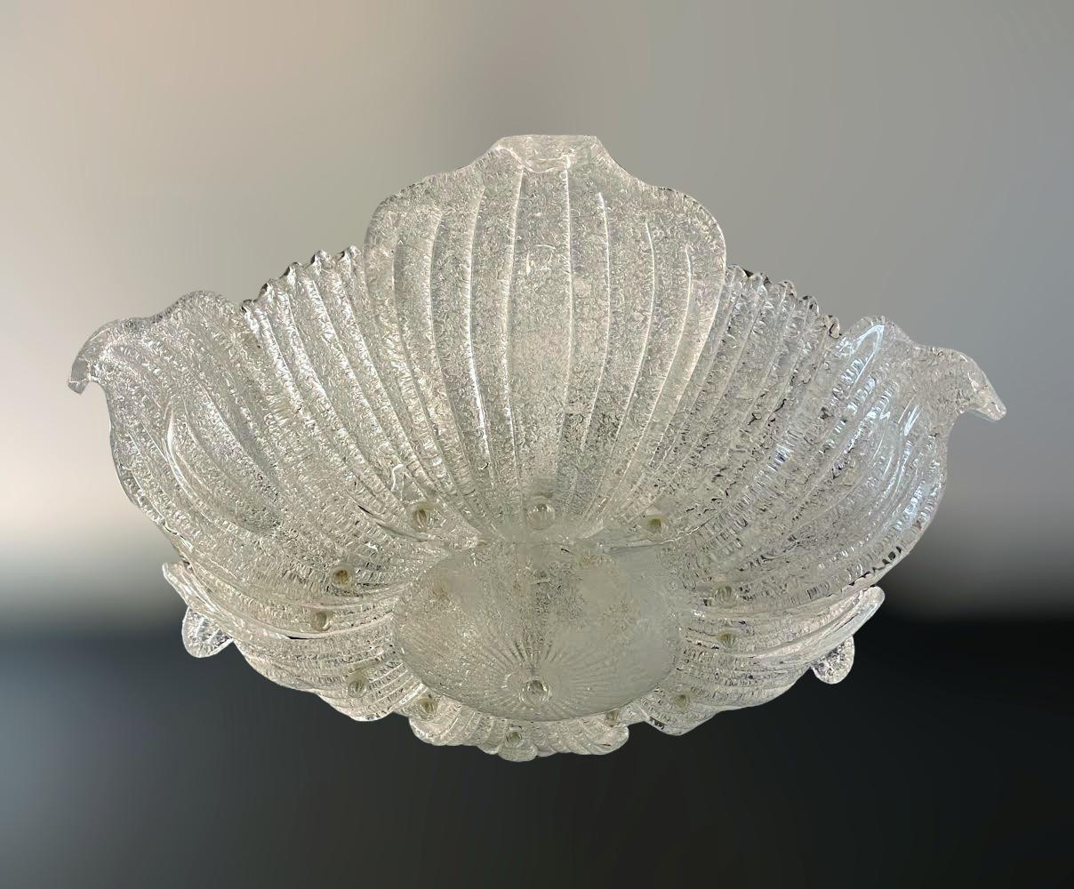 Vintage Italian Murano glass flush mount with clear graniglia glass leaves on white metal frame / Made in Italy in the style of Barovier e Toso, circa 1960s
4 lights / E26 or E27 type / max 60W each
Measures: Diameter 29 inches, height 8 inches
1