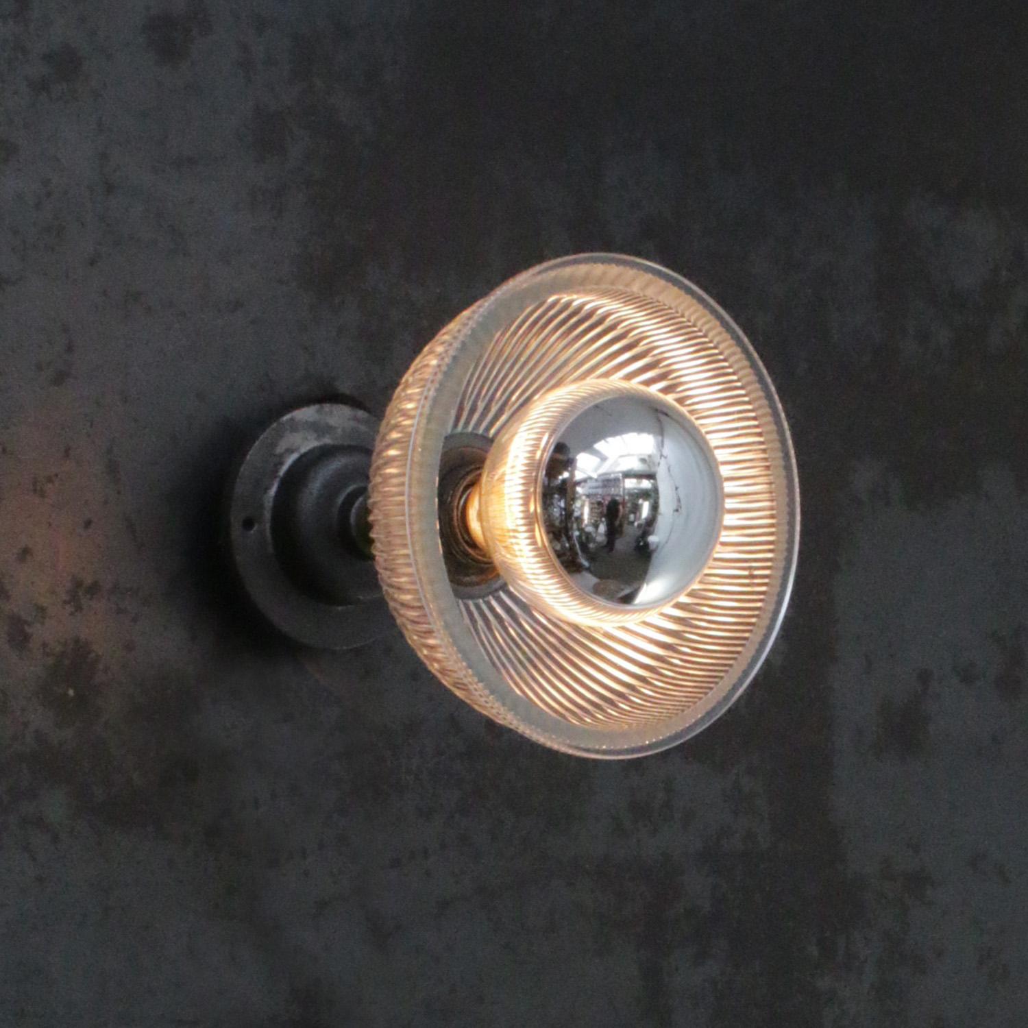 Holophane glass wall light
metal bulb holder with clear striped glass shade

cast iron wall mount diameter 10.5 cm / 4”
wall lamp / ceiling Sconce

Weight: 1.68 kg / 3.7 lb

Priced per individual item. All lamps have been made suitable by
