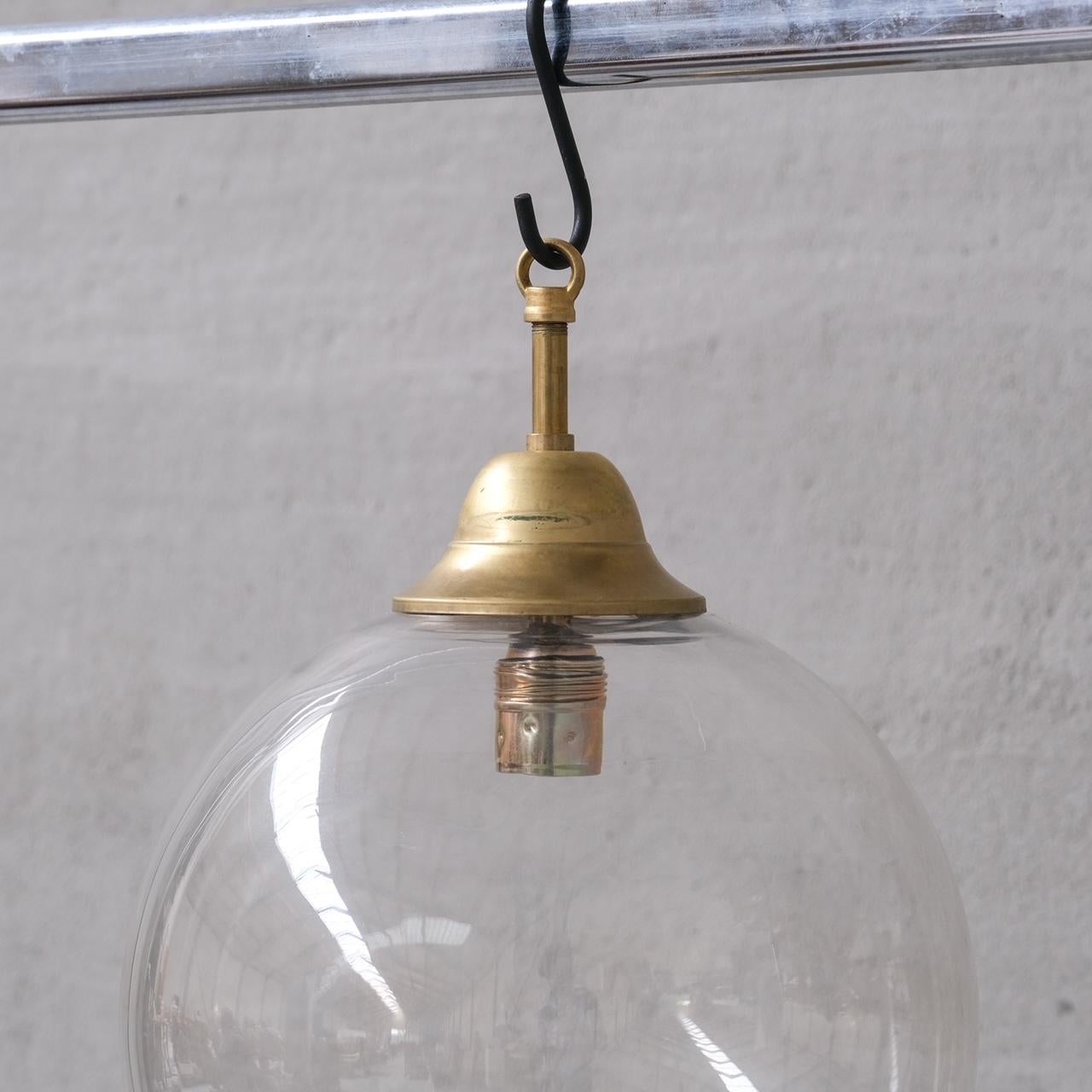 A clear glass and brass pendant lights.

Italy, c1980s.

PRICED AND SOLD INDIVIDUALLY.

15 pieces available at the time of listing.

No chain or rose was retained, however they are easy to source online.

Good vintage condtion, re-wired and PAT