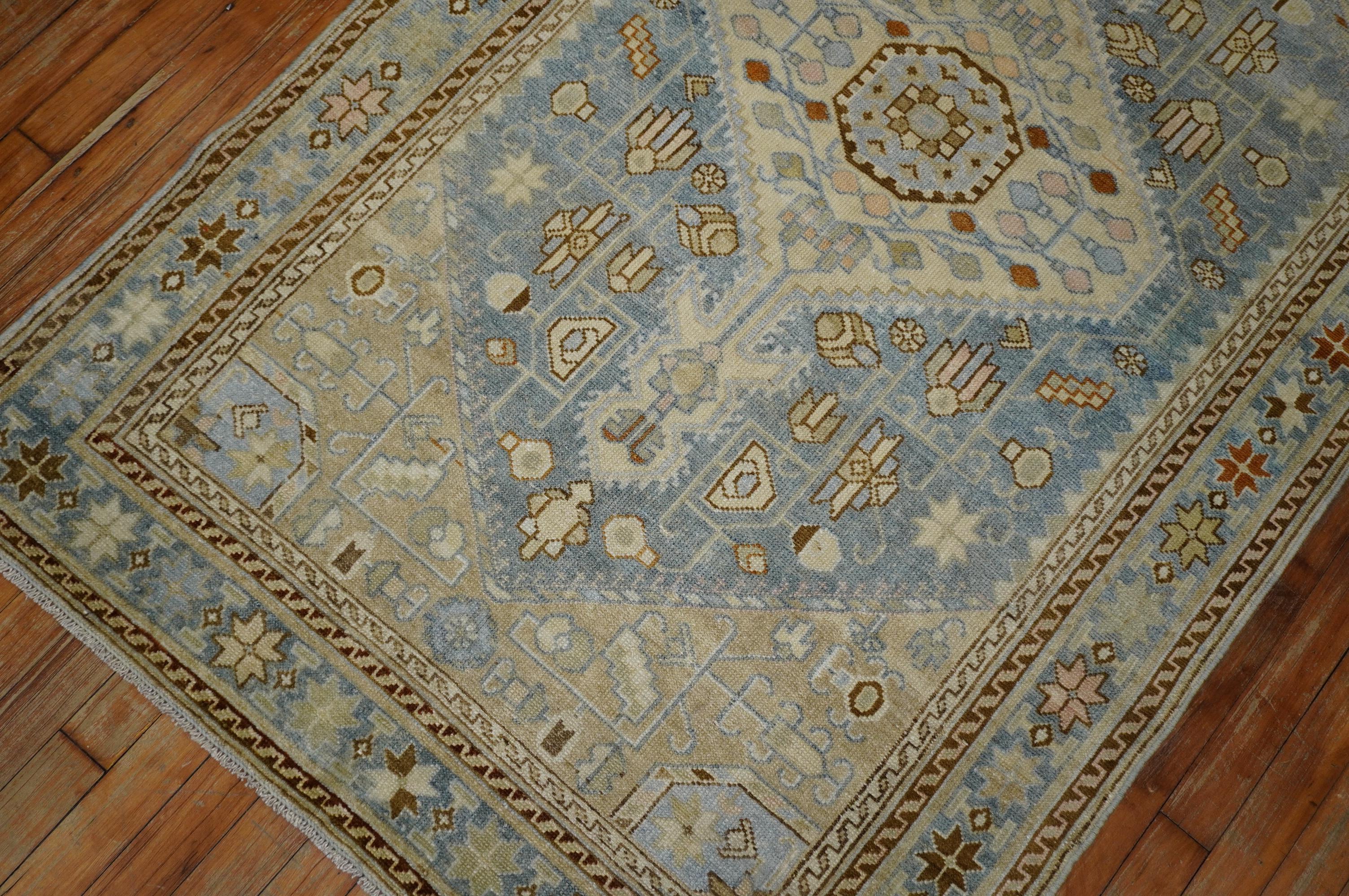 Highly decorative antique early 20th century Persian Malayer rug. Light blue field with dominant accents in ivory and beige with some brown and oatmeal outlines, circa 1940.

Measures: 3'7” x 5'9”.

       
