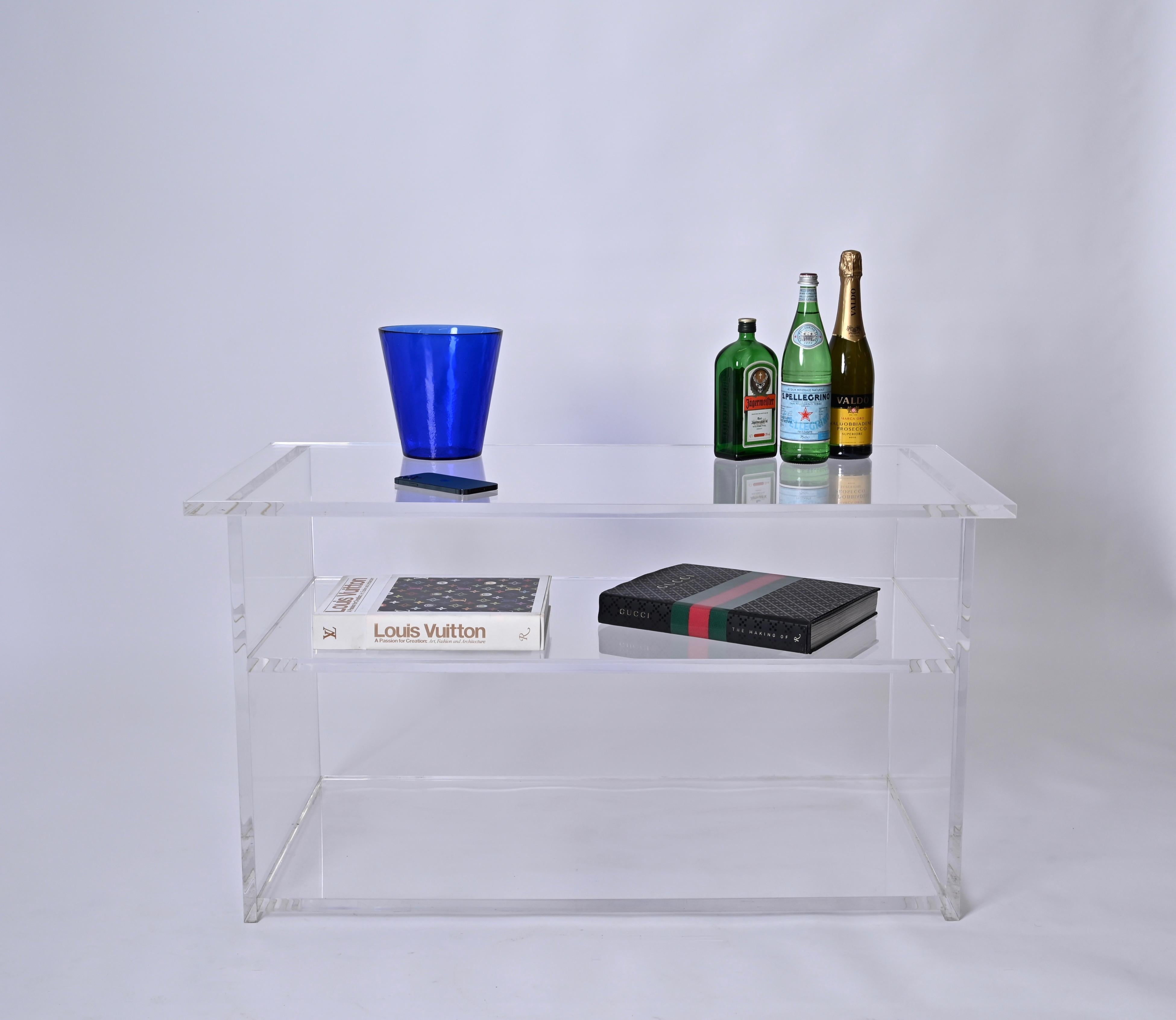 Fantastic Showcase or coffee table fully made in clear lucite. This gorgeous piece was produced in Italy in the 1980s, clearly in the style of Charles Hollis Jones. 

This versatile object can be used as showcase, bookcase or even as a minimal