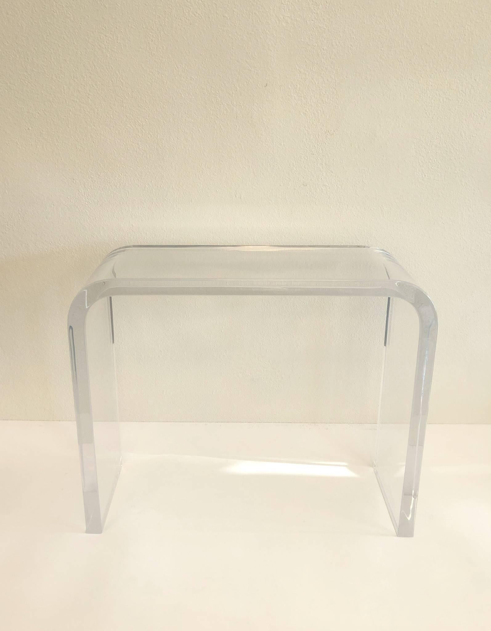 A spectacular 1970s waterfall console table by renowned American designer Charles Hollis Jones. The console is constructed out of one piece of clear acrylic that is 2” thick.
Newly professionally polished.
Dimensions: 34” high 40.5” wide and 14”