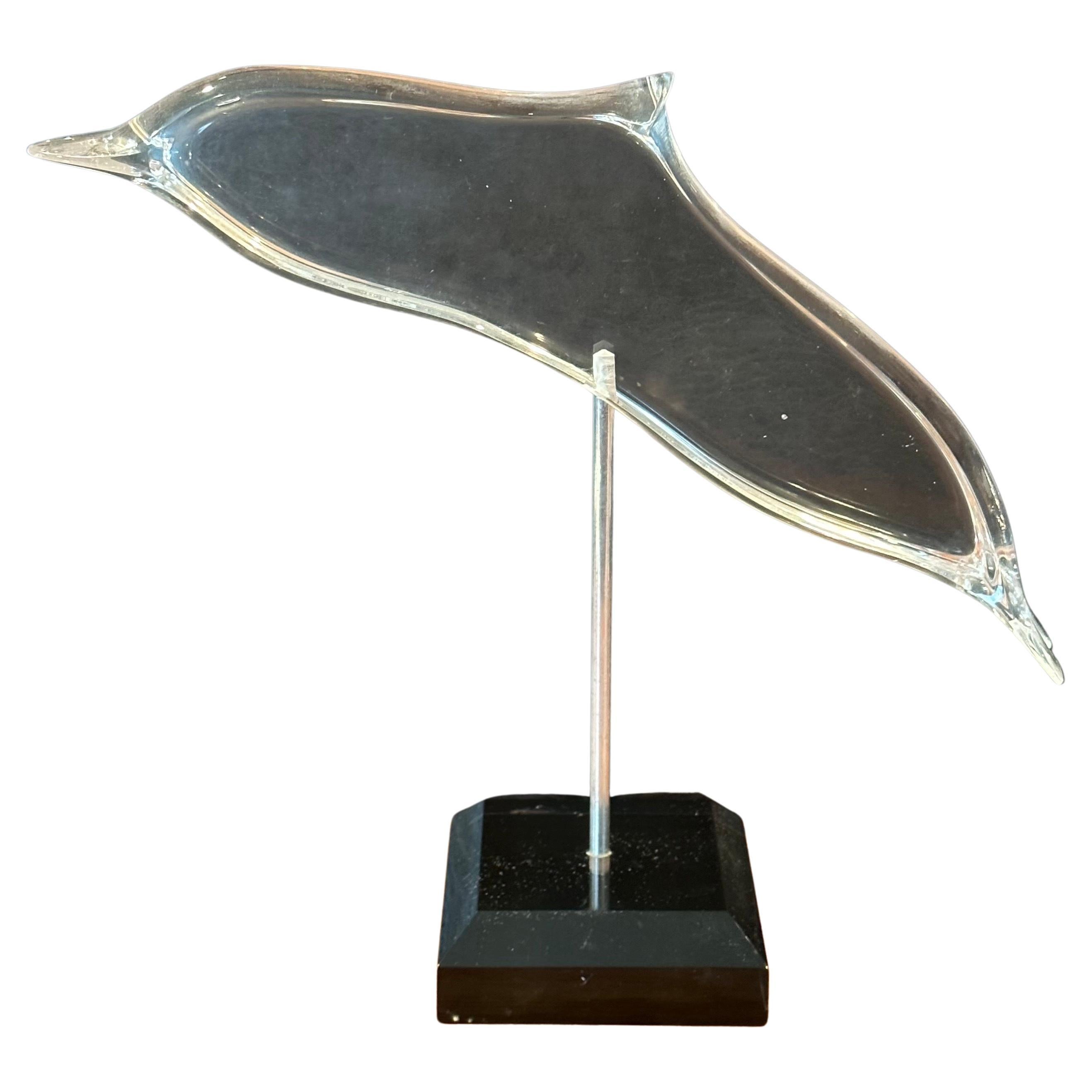 Beautiful clear lucite whale sculpture on black base, circa 1990s. The piece is in very good vintage condition with no chips or cracks and measures 12.5