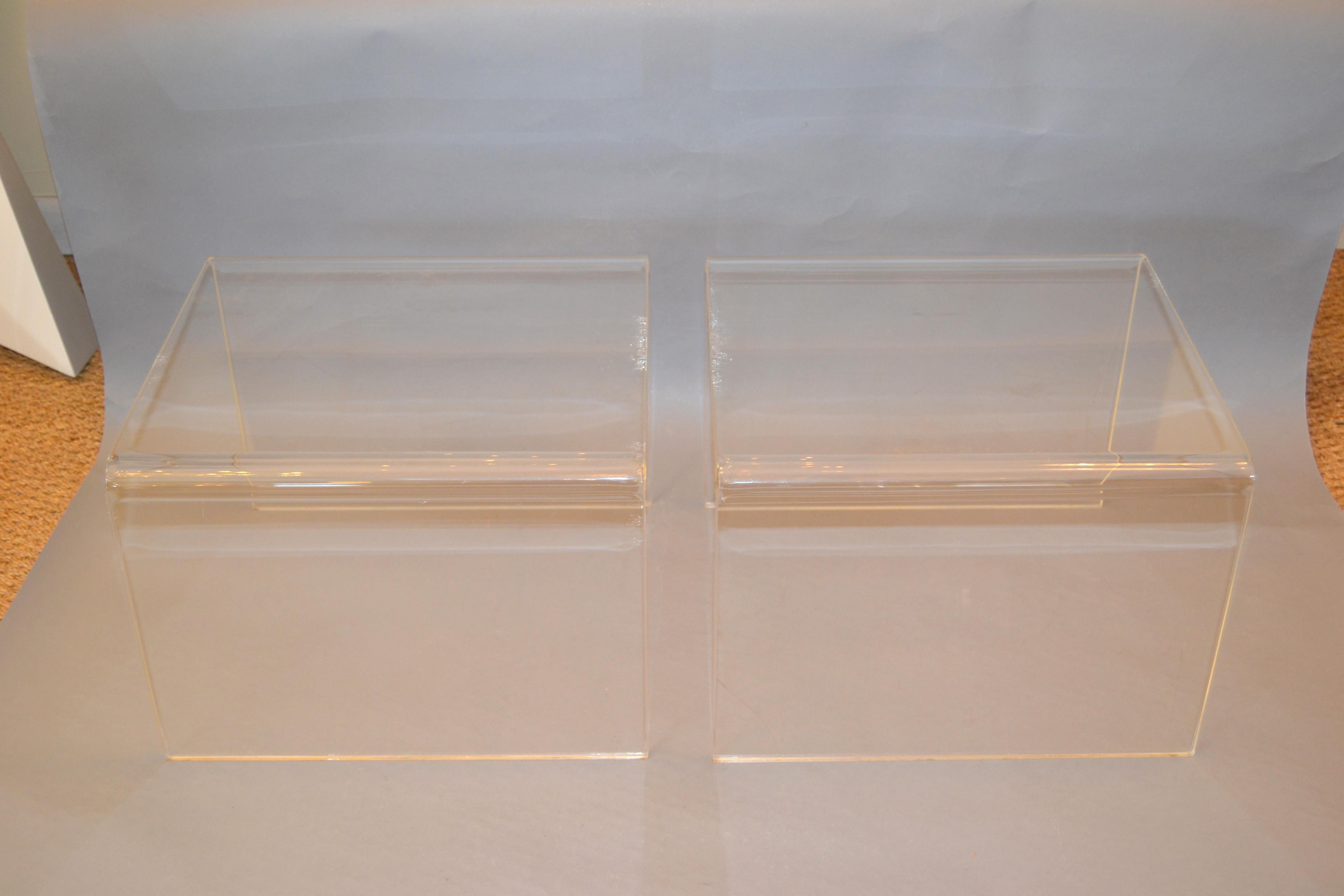 A pair of clear Mid-Century Modern Lucite end tables, sofa tables or side tables.
Cute little waterfall design.
  