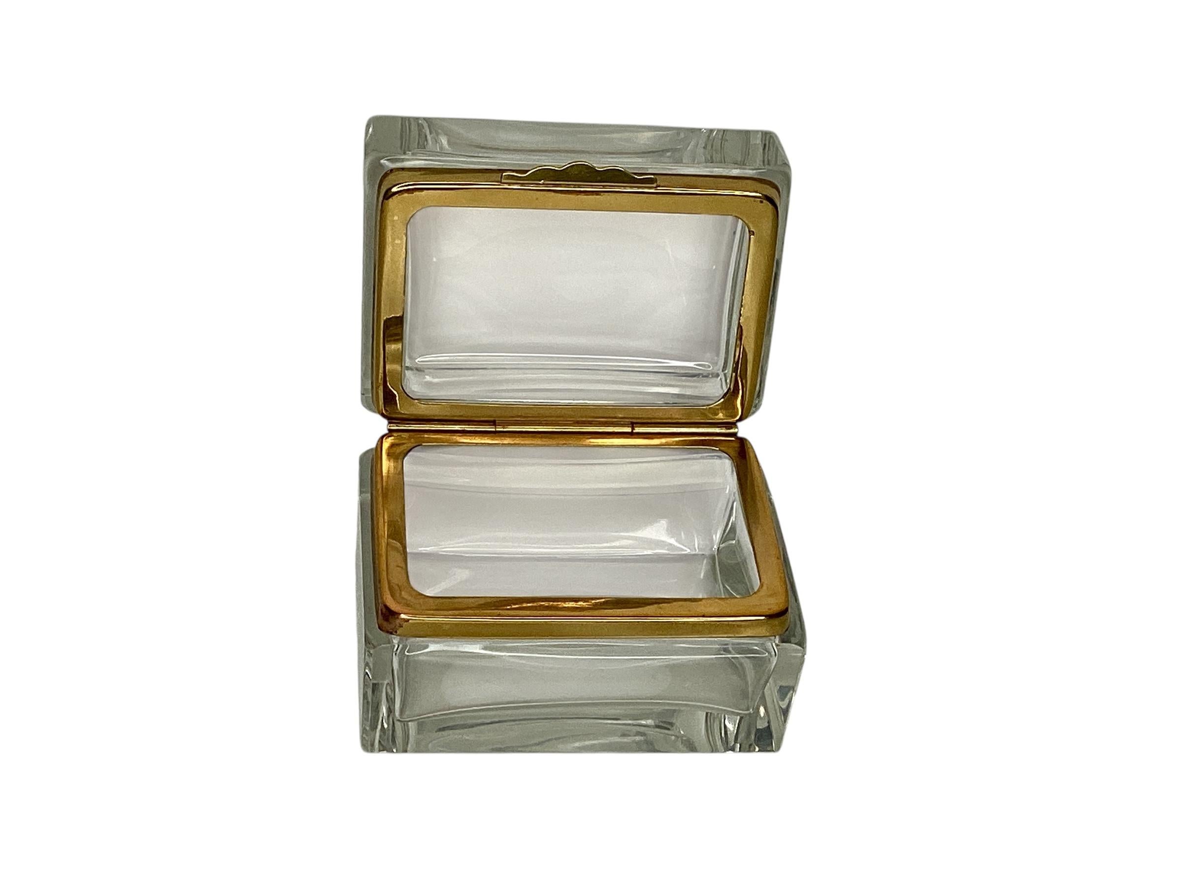 A clear Murano glass box with gilt metal fitting. In very good vintage condition. A great addition to a book shelf or a dressing table.