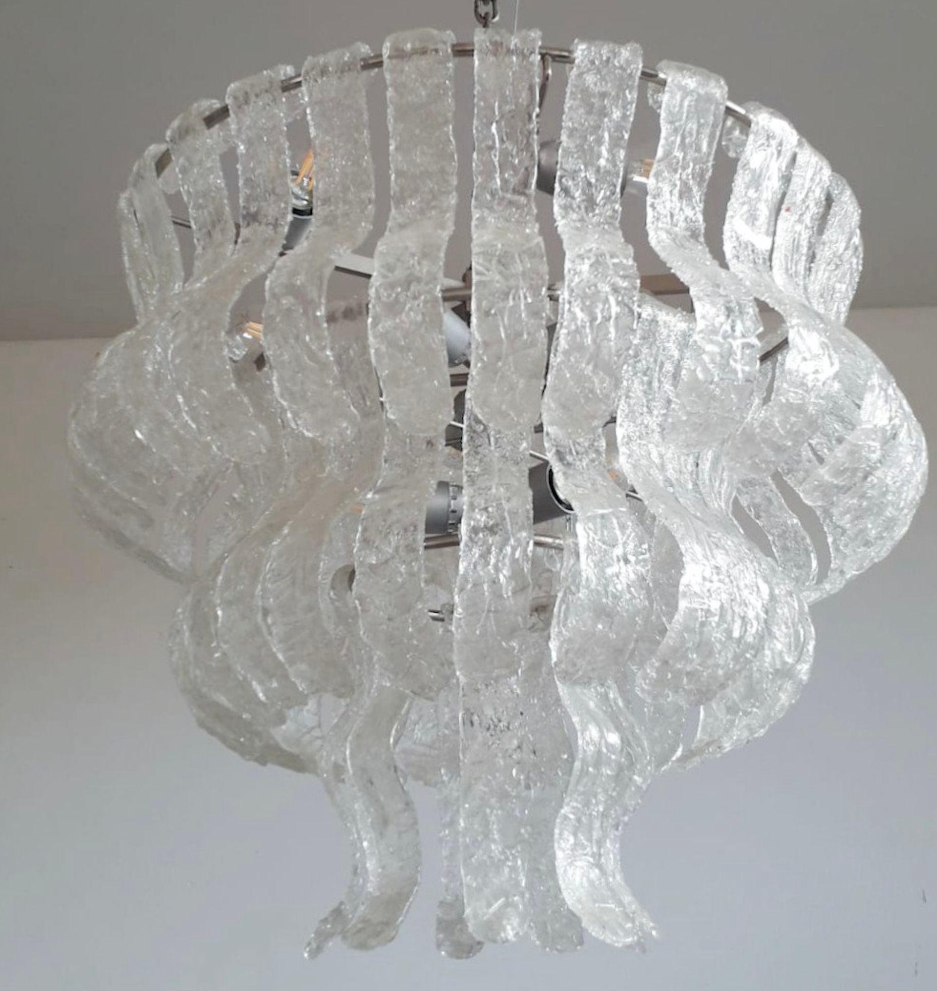 Vintage Italian chandelier with layered clear curved textured Murano glass panels / Made in Italy by La Murrina, circa 1960s
Measures: Diameter 25.5 inches / height 21.5 inches plus chain and canopy