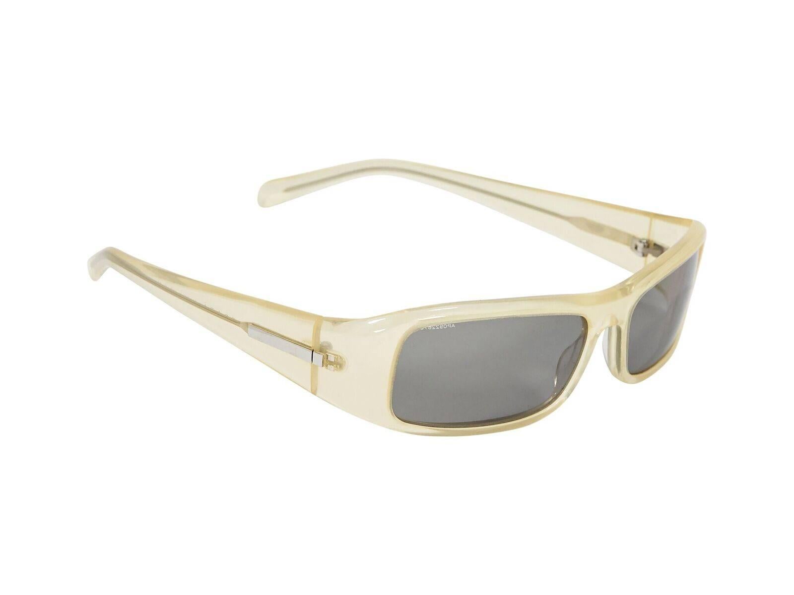 Product details:  Clear rectangular small sunglasses by Prada.  Silvertone hardware.  1.5