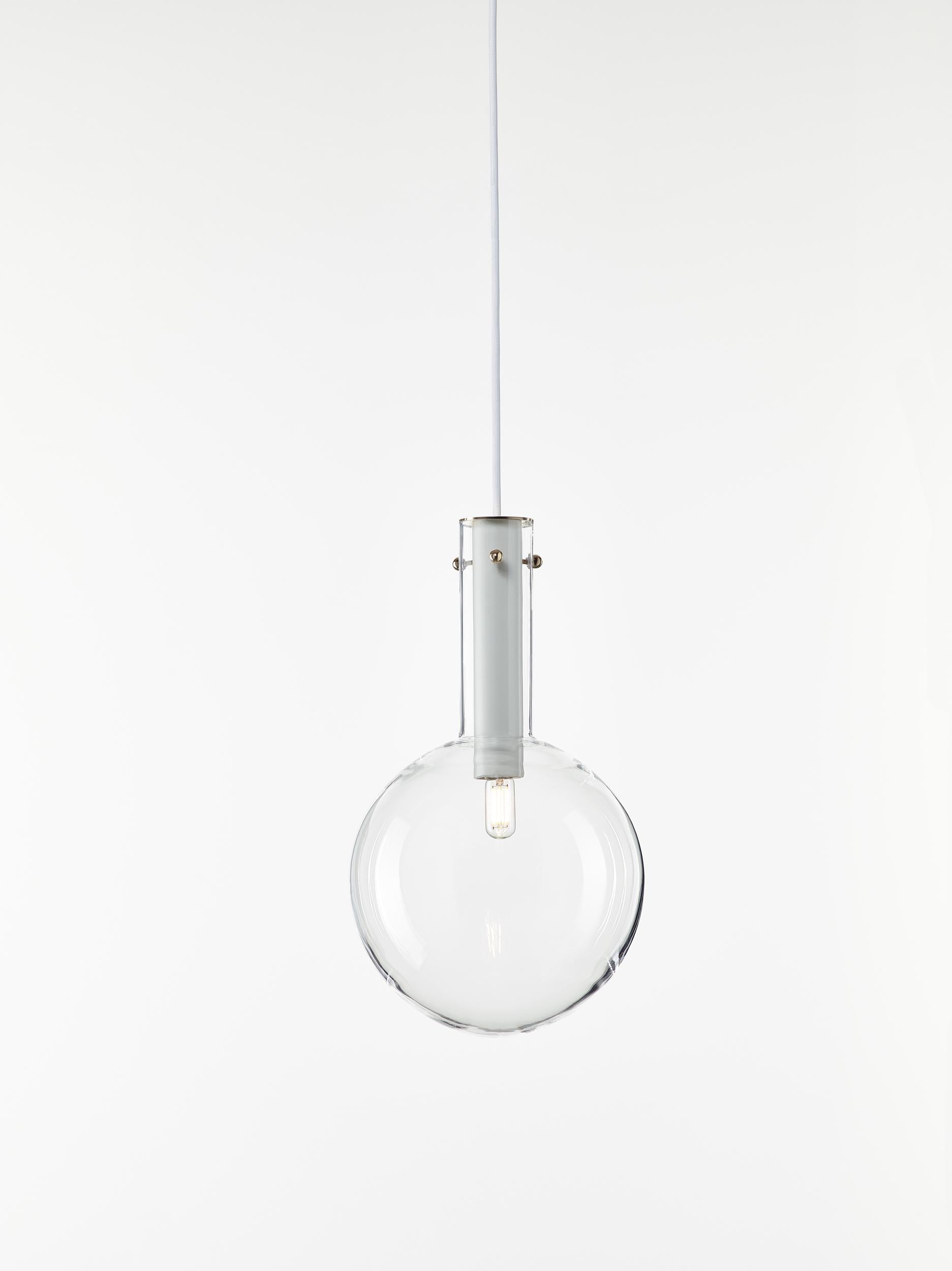 Clear Sphaerae pendant Light by Dechem Studio
Dimensions: D 20 x H 180 cm
Materials: brass, metal, glass.
Also available: different finishes and colors available.

Only one homogenous piece of hand-blown glass creates the main body of Sphaerae