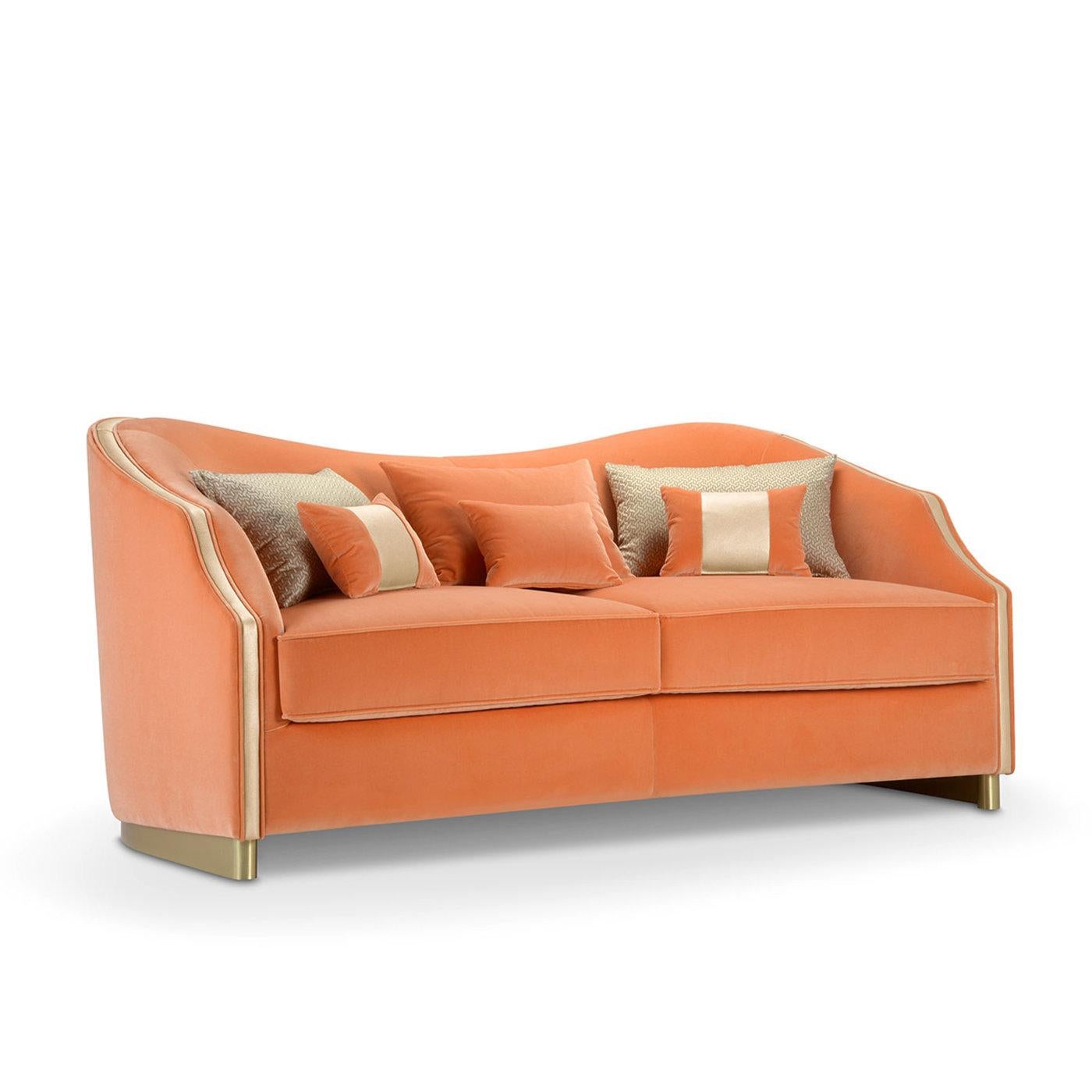 Sinuous and sophisitcated lines trace the profile of this handcrafted sofa, which is dedicated to Cleio, the Greek muse patron of history. The wavy backrest hiding a smooth shell curves and slopes at the sides to form comfortable armrests, while a