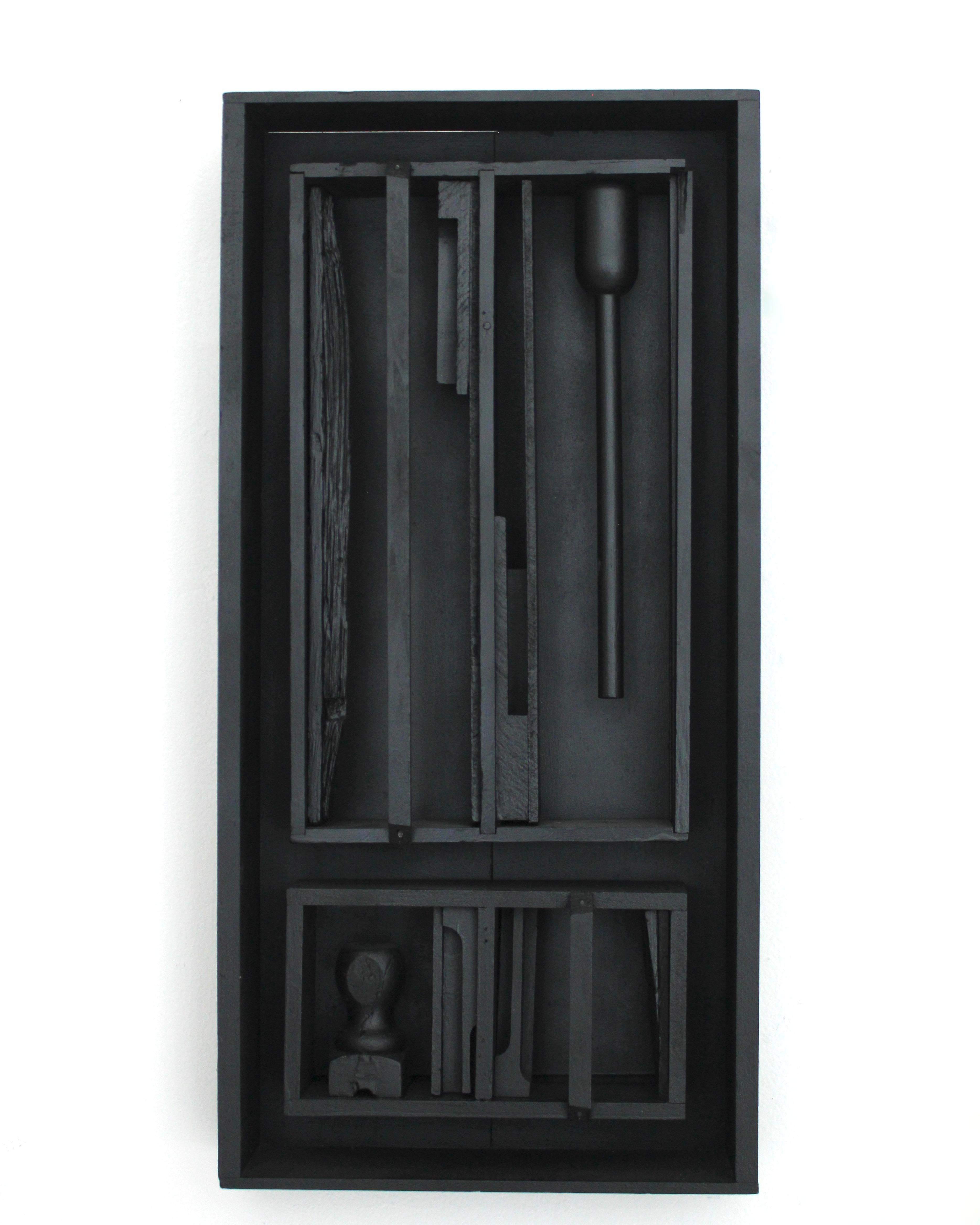 Clem Pennington in the style of Louise Nevelson black painted assemblage wood sculpture. 
The photos are slightly overexposed to show the sculptures details. 

Measures: 12”W X 3.5”D X 24.5”H.