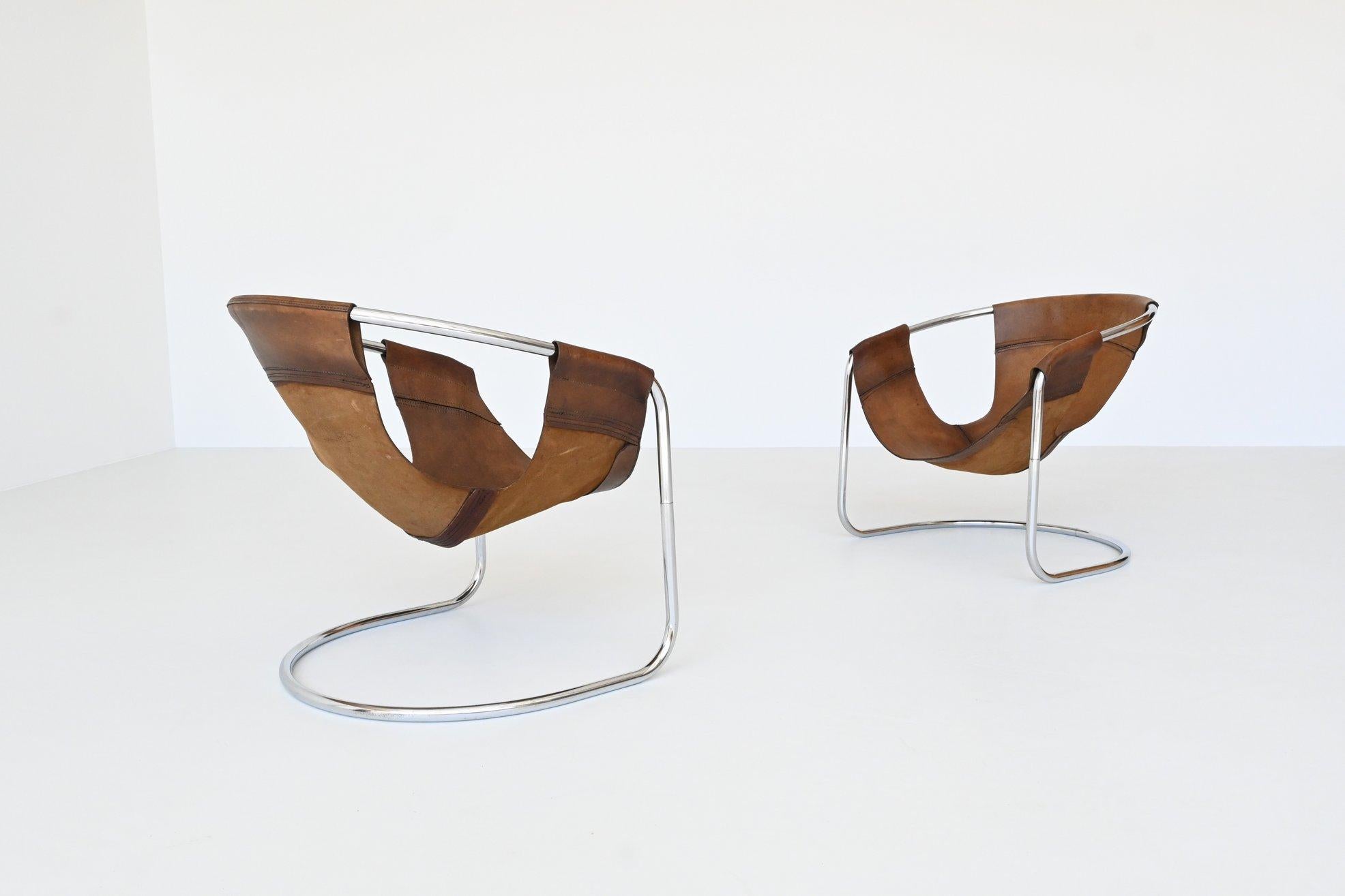 Fantastic pair of lounge chairs designed by Clemens Claessen and manufactured by Ba-as Eindhoven, The Netherlands 1965. These very nice shaped lounge chair have a tubular chrome plated metal frame that exists in two parts and the seats are made of