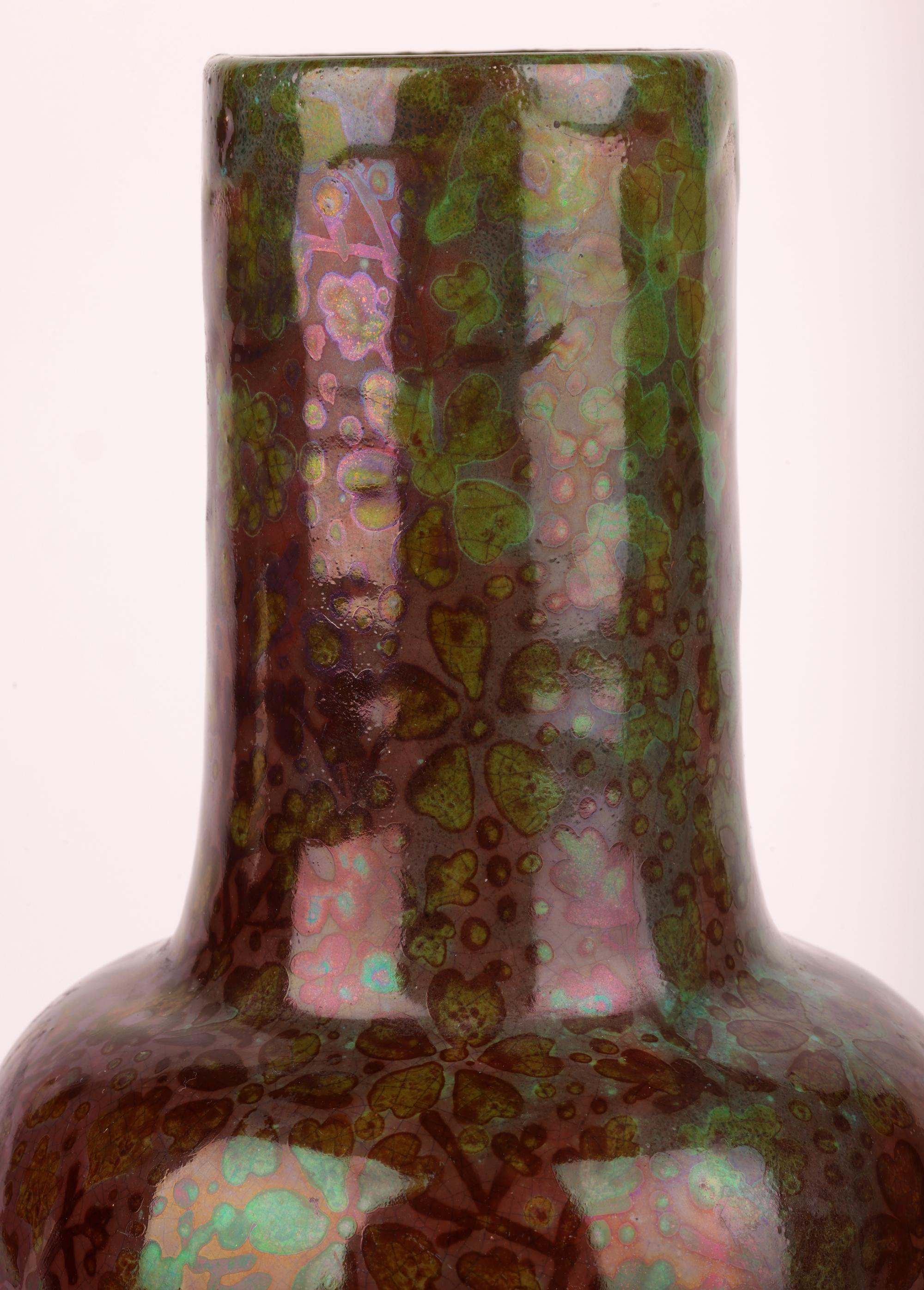 A stunning Art Nouveau floral design art pottery vase decorated in iridescent glazes attributed to renowned French ceramic artist Clement Massier (1845-1917) dating from the latter end of the 19th century. The lightly potted and large shaped vase is