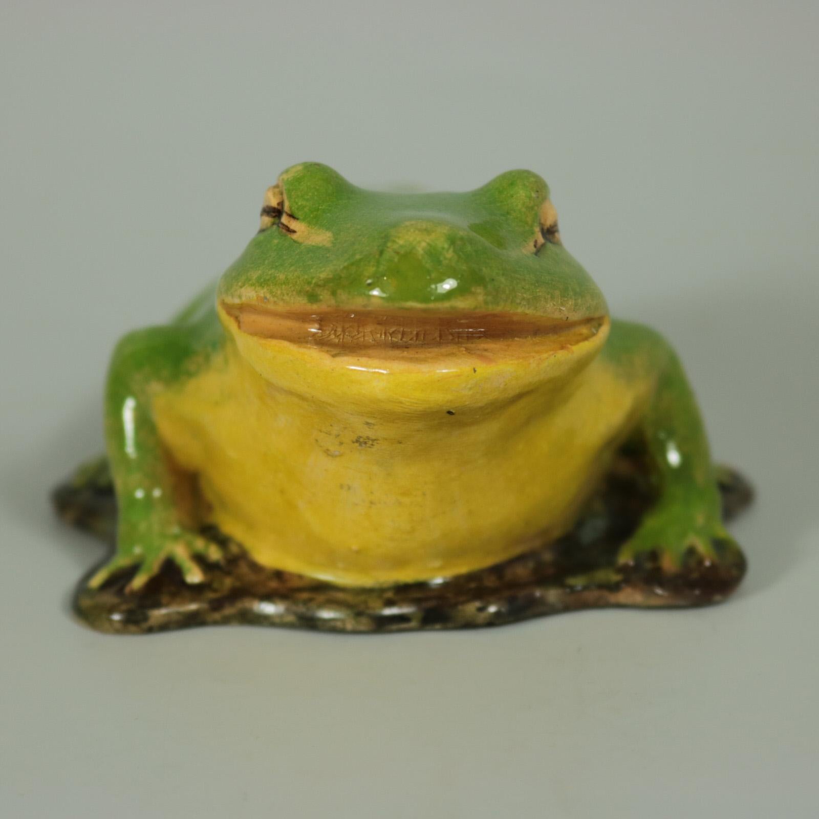Clement Massier French Majolica figure which features a frog. Coloration: green, yellow, brown, are predominant. The piece bears maker's marks for the Clement Massier pottery. Book reference,'Barbotines de la Côte d'Azur' by Maryse Bottero, page 86,