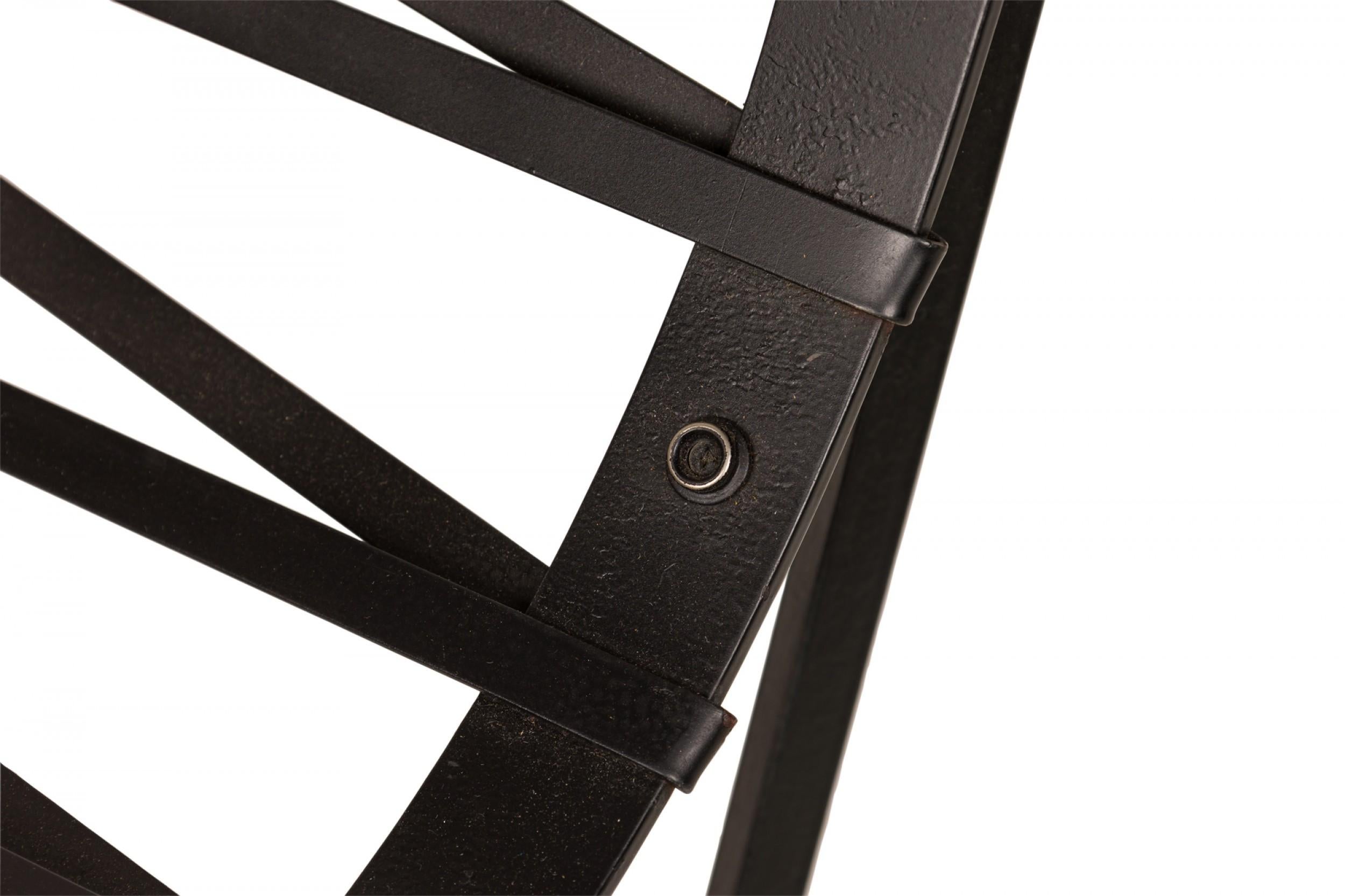 Mid-Century American (1970s) X-frame bar stool with a brown snakeskin upholstered seat pad with button tufted detail, resting on a sturdy iron and oak frame. (CLEO BALDON FOR TERRA OF CALIFORNIA)(Other examples in different upholstery: DUF0830,