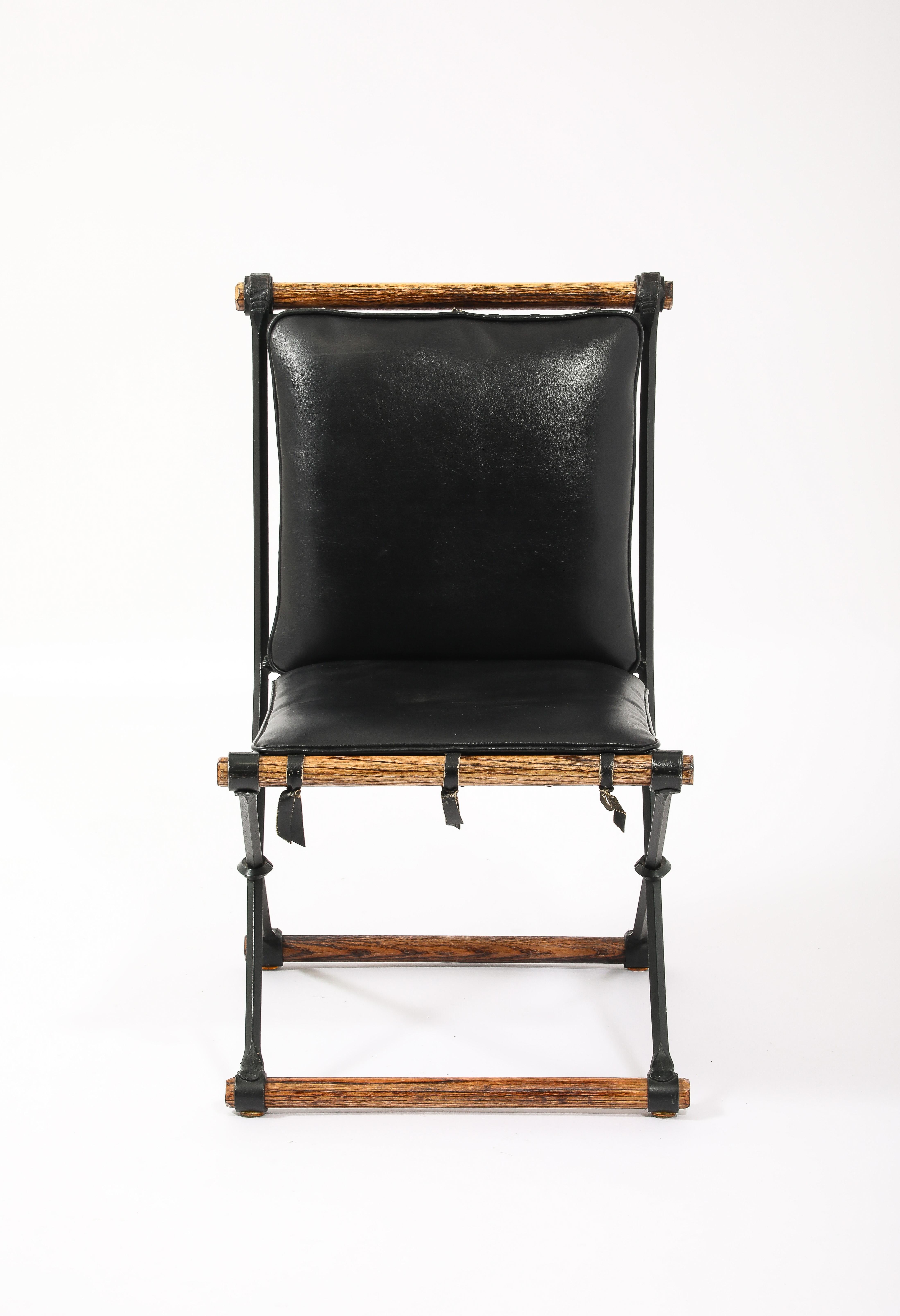 An original set of Cleo Baldon side chairs in wrought iron and bamboo with original patina and cushions, some labels remain.

