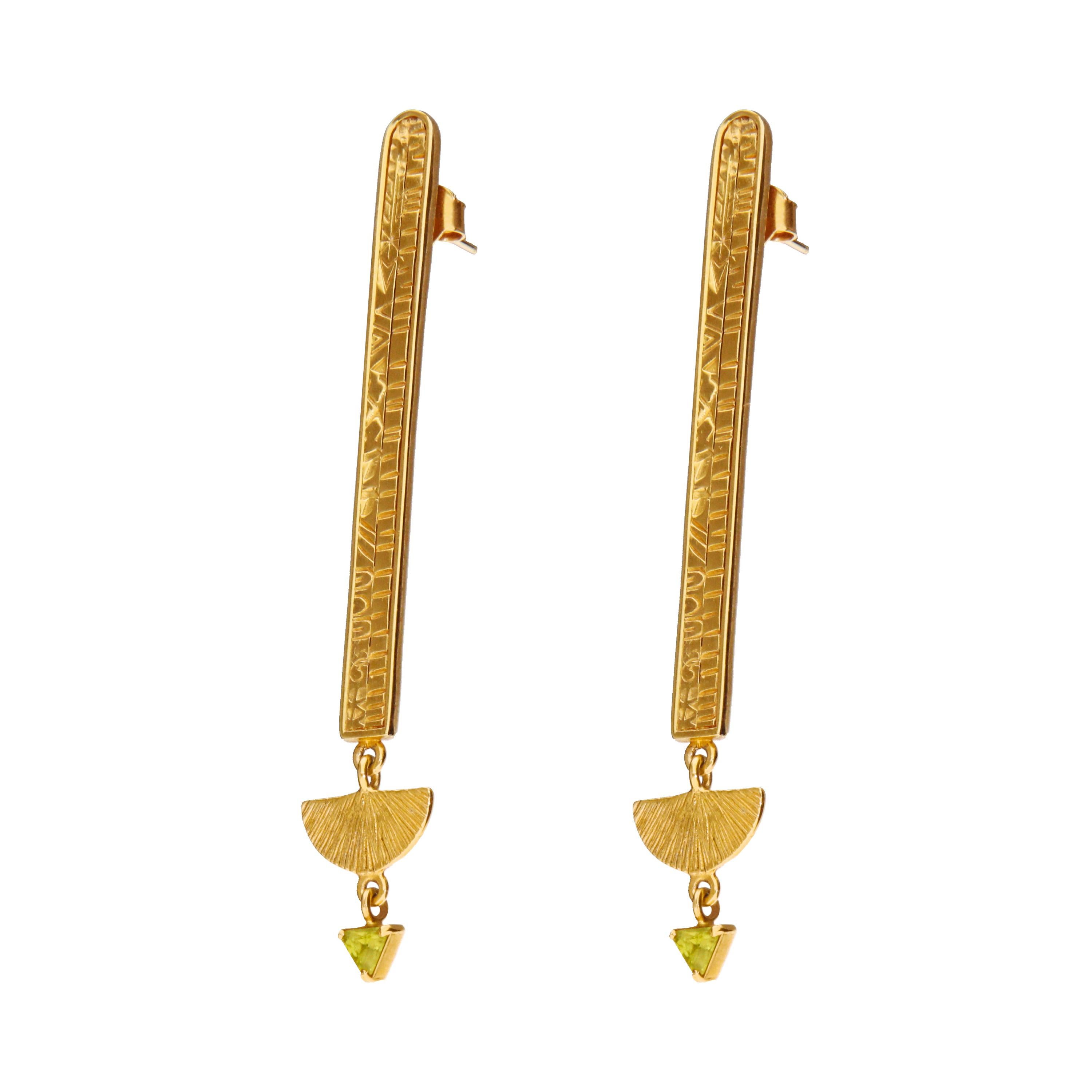 Embrace the mystique of ancient Egypt with the Cleo Earrings, skillfully crafted from 14k yellow gold. Inspired by the aesthetics of this captivating civilization, these earrings feature sleek and simple lines that seamlessly blend the ancient with