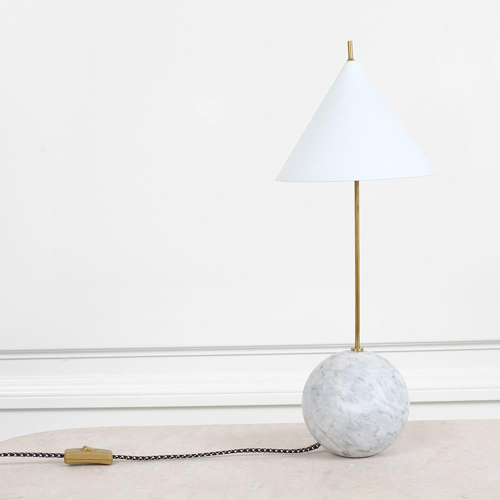 A dramatic and architectural take on Kelly’s signature use of mixed metals and geometric forms, this refined and bold lamp juxtaposes organic feminine curves with sleek masculine precision. Its distinctive voice is full of modern sophistication and
