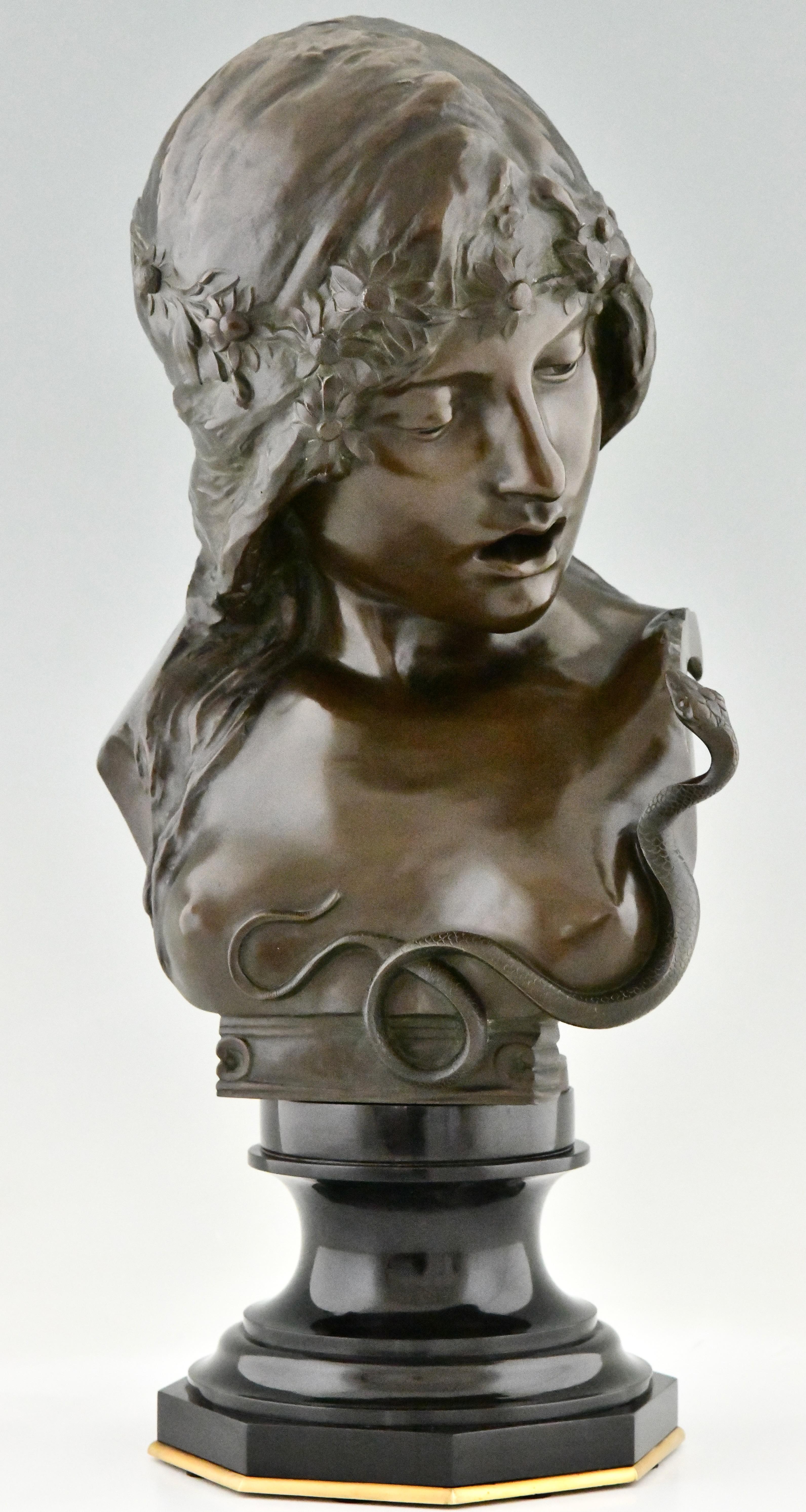 Cleopatra, Art Nouveau bronze bust woman with snake by Isidore De Rudder
With foundry seal Luppens & Cie, Bruxelles. 
Patinated bronze on a Belgian Black marble & bronze base.  
Illustration of this model in:
Beeldhouwkunst in België, Engelen Marx.