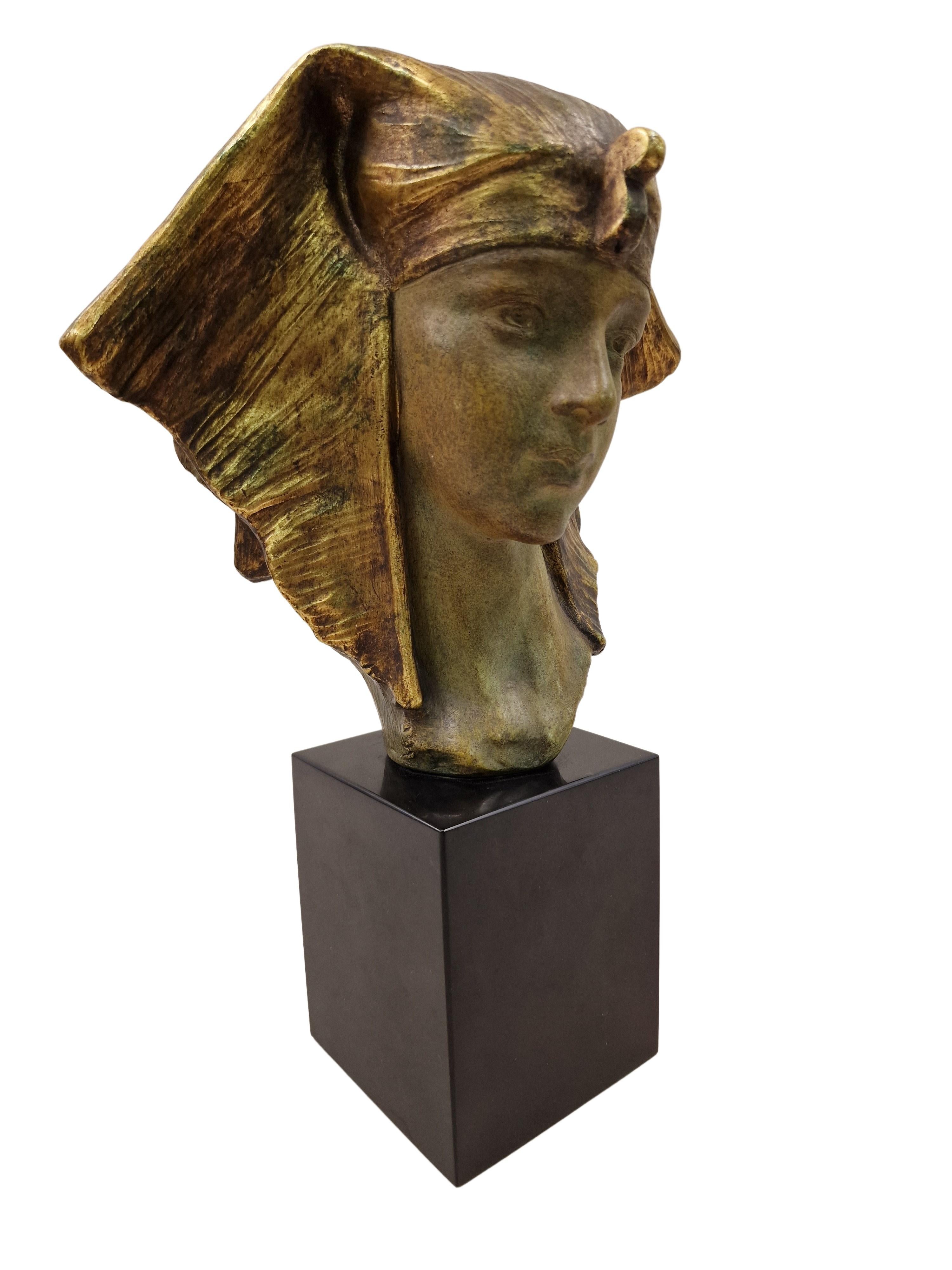 Rare particularly beautiful depiction of the Egyptian Queen Cleopatra. Created by Gustave van Vaerenbergh under his pseudonym G. Carli from the Art Deco period. This terracotta was polychromed by hand, which beautifully emphasizes the fine facial