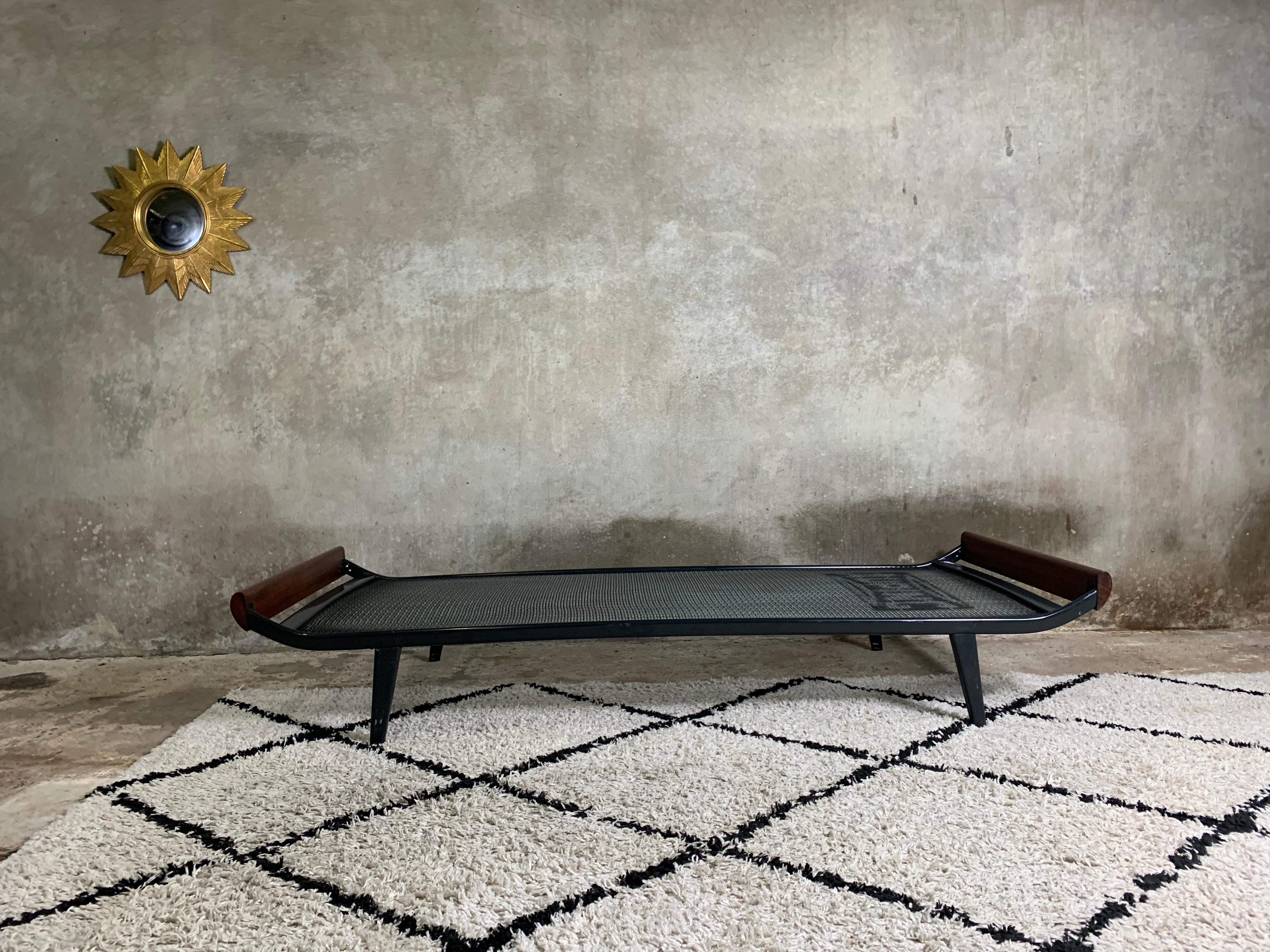 Classic design by Andre Cordemeijer for Auping factory. It was exposed on Milan Triennale in 1954. It is one of those projects which seams to be perfect and any change has to be only for worse. Simple metal frame and teak elements connected in