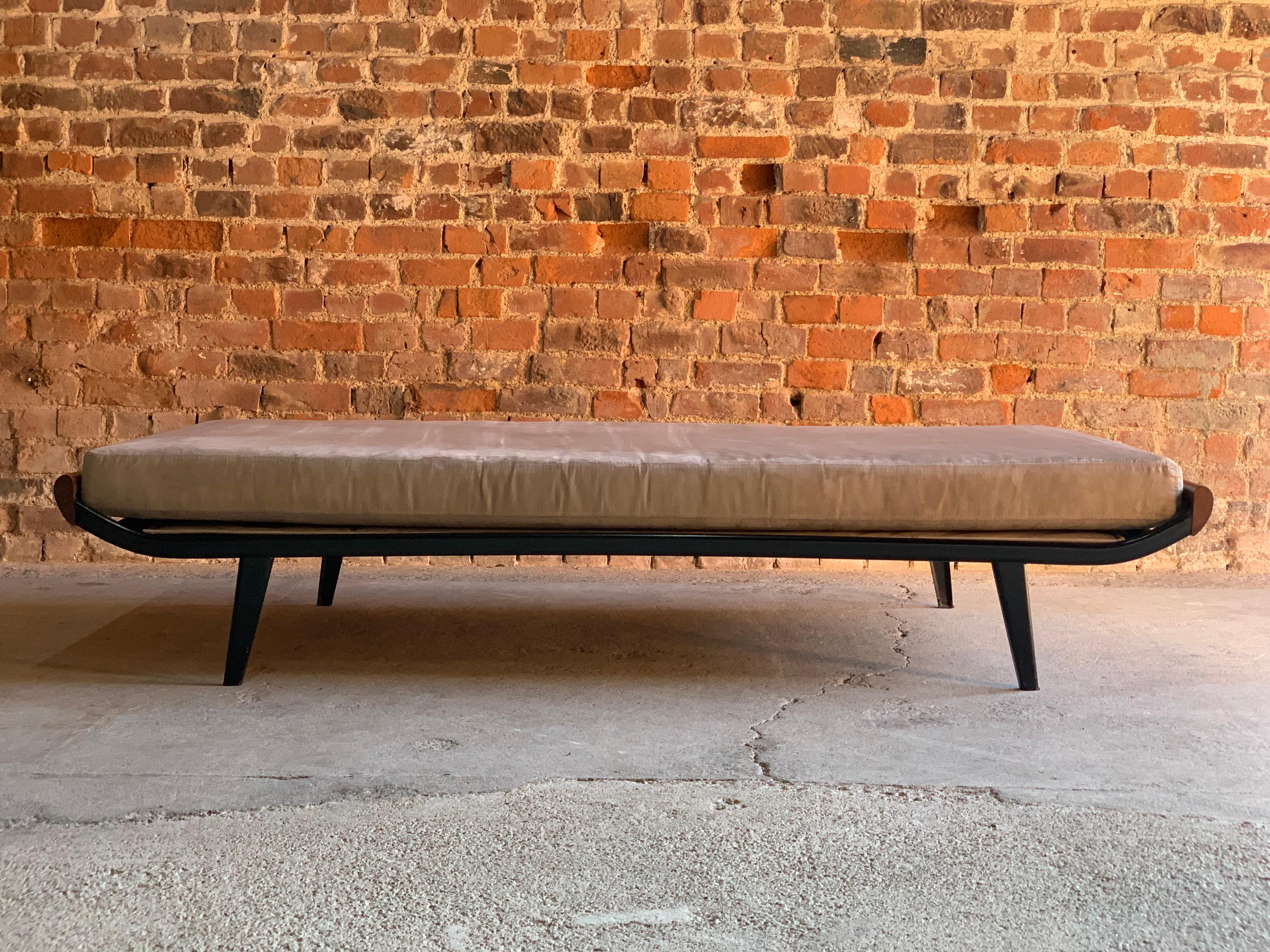 Cleopatra daybed by Dick Cordemeijer for Auping, 1950s design

Dick Cordemeijer for Auping ‘Cleopatra’ teak daybed designed in1950, the Teak ends with black metal bed frame, the cream ultra suede mattress resting over a mattress topper on sprung