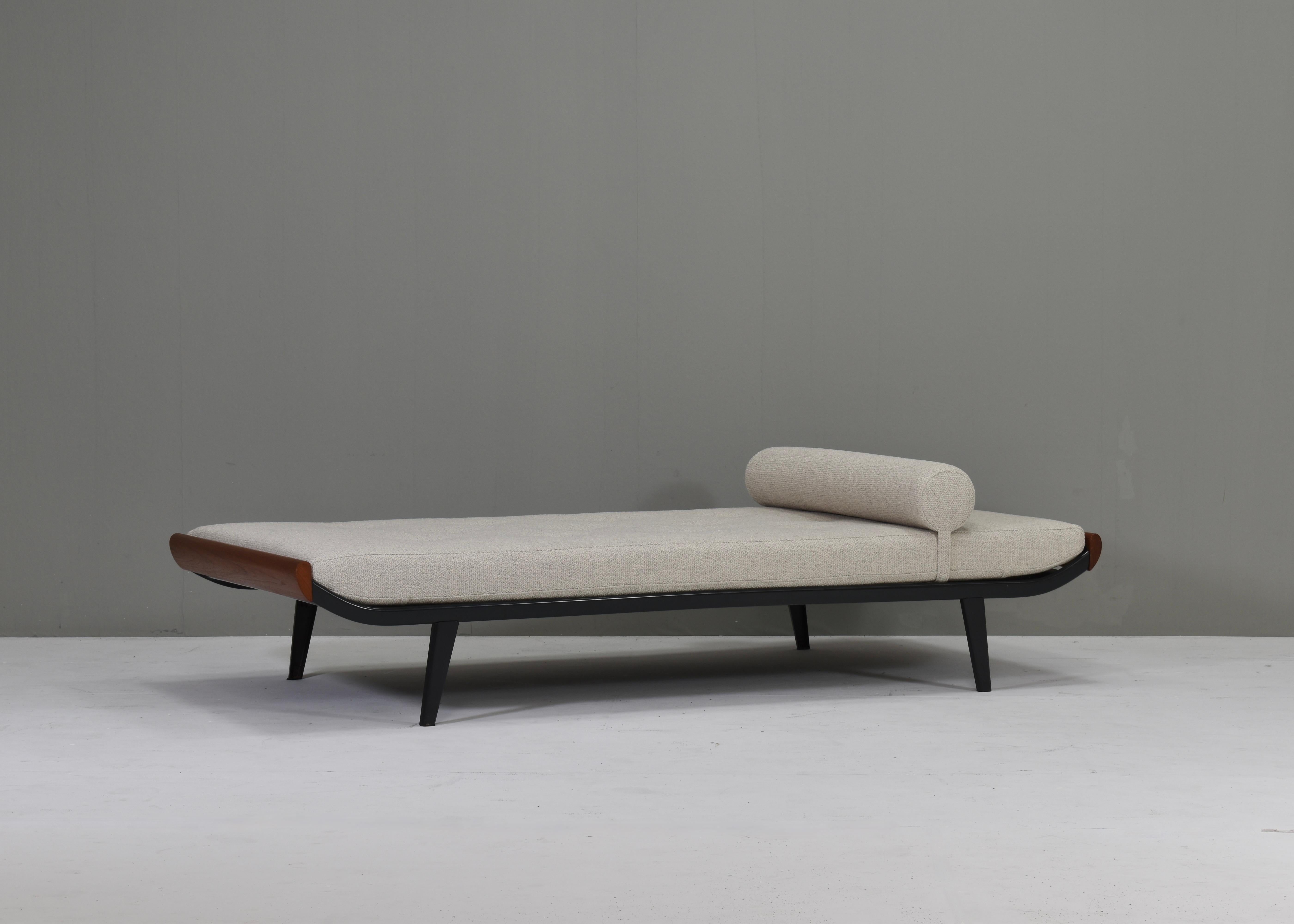 New upholstered daybed by Dick Cordemeijer for Auping, Netherlands – 1953.
The Cleopatra daybed has a new mattress and bouclé beige creme fabric by De Ploegstof model Monza.
In good condition with new mattress and upholstery. The metal frame shows