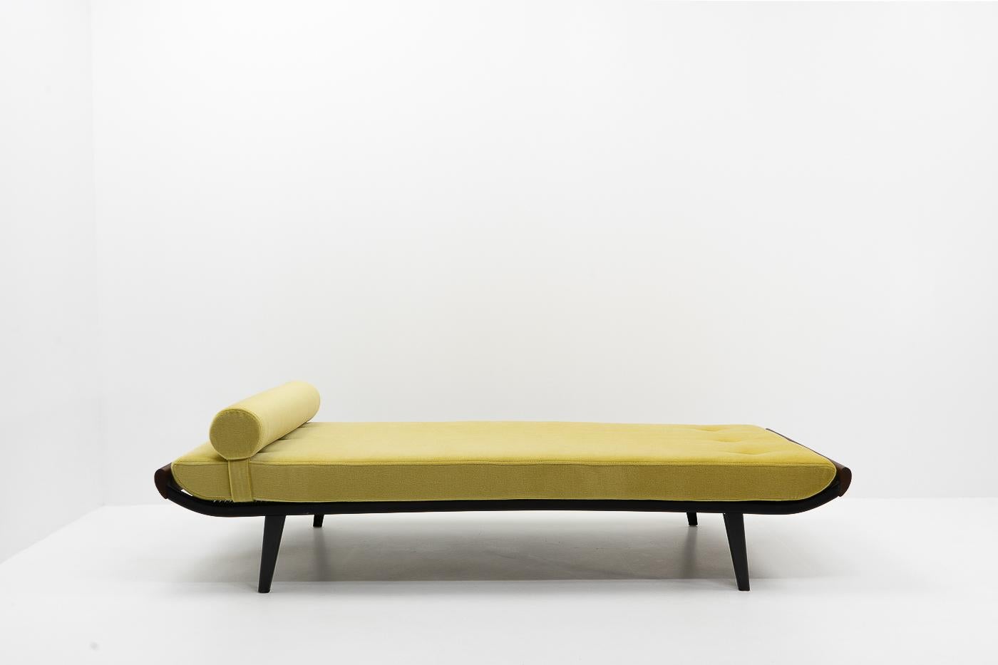 Vintage daybed designed by Dick Cordemeijer for Auping (the Netherlands) during the 1950s.

New exclusive mustard-colored natural mohair and foam; the daybed can be used as both a sofa and spare bed. The cover features a zipper on both pillow and