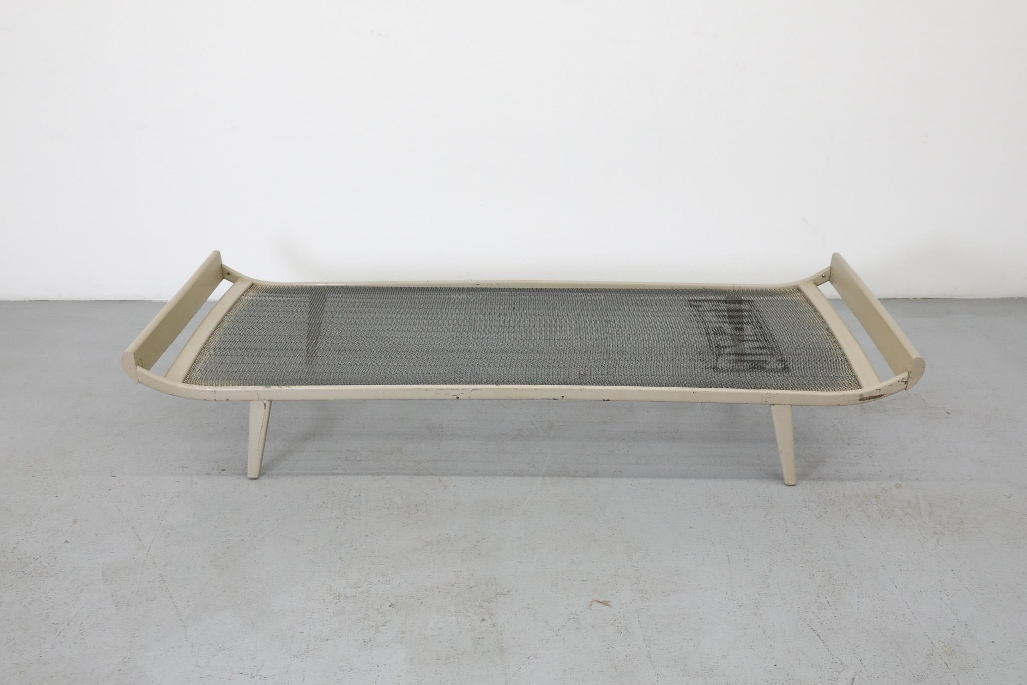 Part of our special limited edition collaboration with Los Angeles Textile Studio Block Shop. 1960's Cleopatra style daybed by A.R. Cordemeyer for Auping with painted teak ends and off white enameled metal frame with 