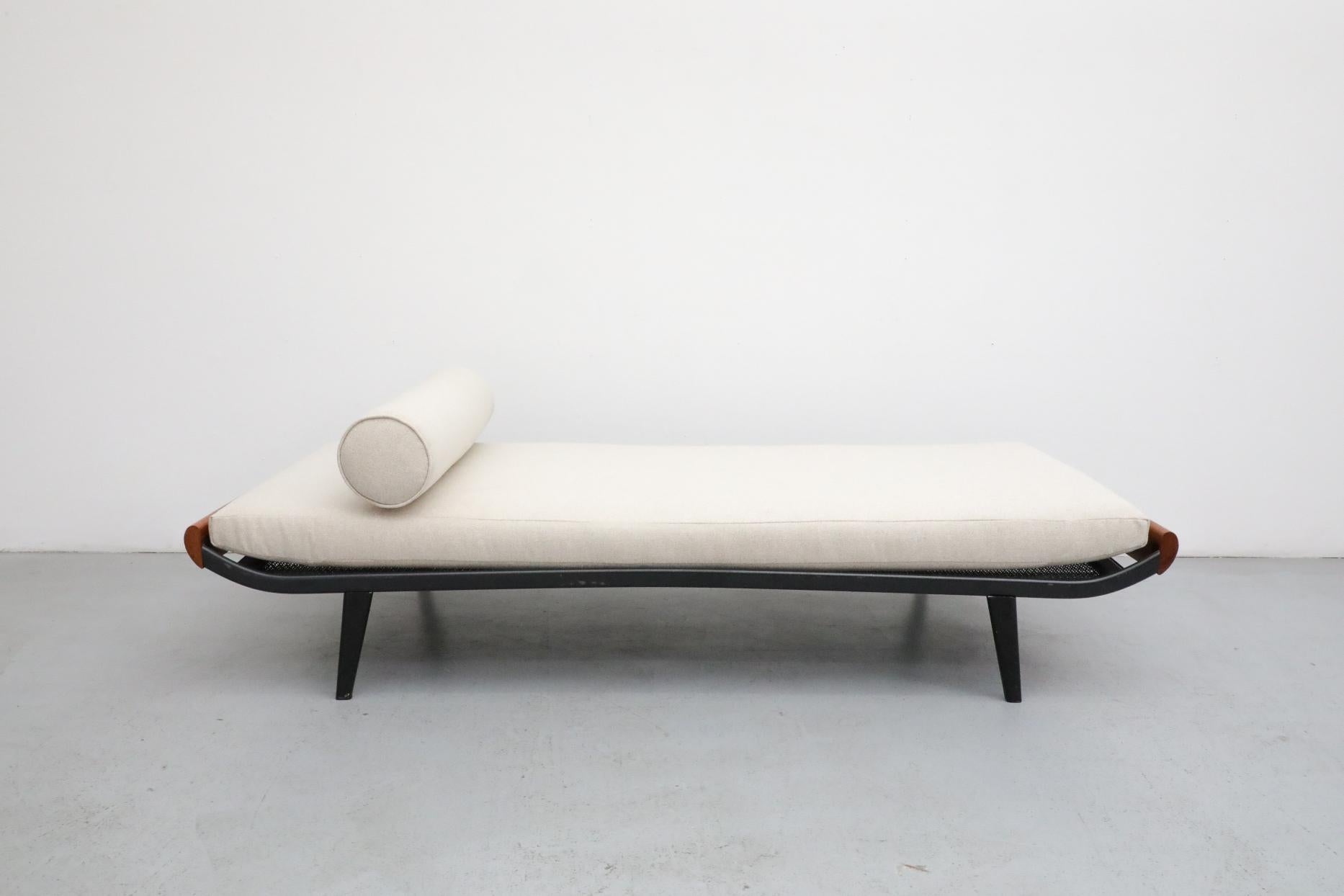 Mid-Century, 1960's Cleopatra wide daybed by A.R. Cordemeyer with teak ends and dark gray enameled metal frame. Manufactured by Royal Auping, the Cleopatra divan bed was developed by Cordemeyer in 1953 to fit in with the newly updated, more