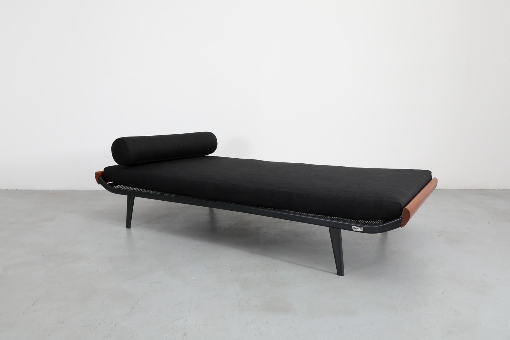 Mid-Century, wider 1960's Cleopatra daybed by A.R. Cordemeyer with teak ends, enameled metal frame and new black mattress and bolster. Manufactured by Royal Auping, the Cleopatra divan bed was developed by Cordemeyer in 1953 to fit in with the newly