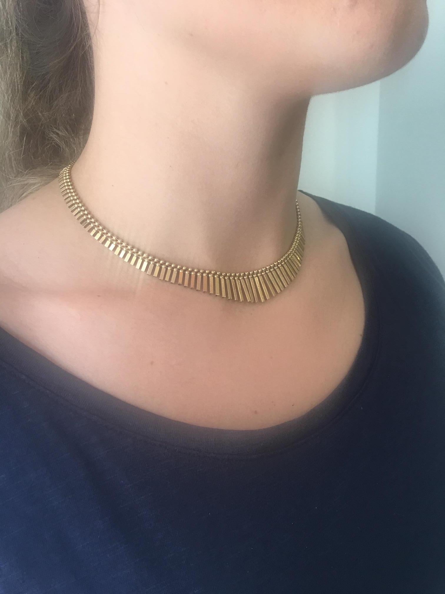 Feel like an Egyptian goddess with this 18k gold Cleopatra style tapered necklace; graduated flat bars define the beauty of this lovely necklace, hand crafted in 18k gold, secure invisible insertion clasp with a figure 8 safety. Hallmarked 18K 750