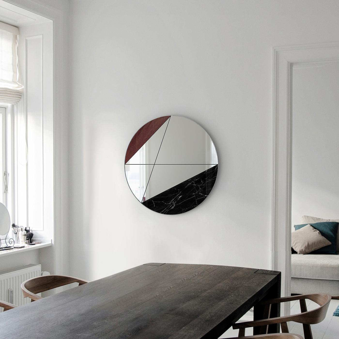 Made by hand exclusively in natural materials, no two clepsydra mirrors are exactly alike. This version, featuring brown leather and Marquinia marble, combines warm and cold tones to perfection, joining them together with the collection's signature