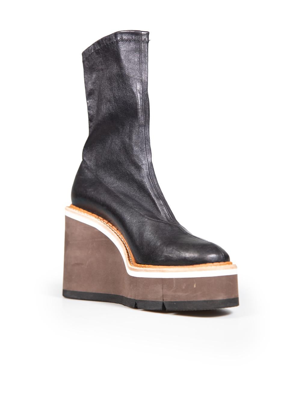 CONDITION is Very good. Minimal wear to boots is evident. Minor cracker of rubber sole on the right side of the right side of the right shoe on this used Clergerie designer resale item.
 
 Details
 Black
 Leather
 Ankle boots
 High wedge heel
