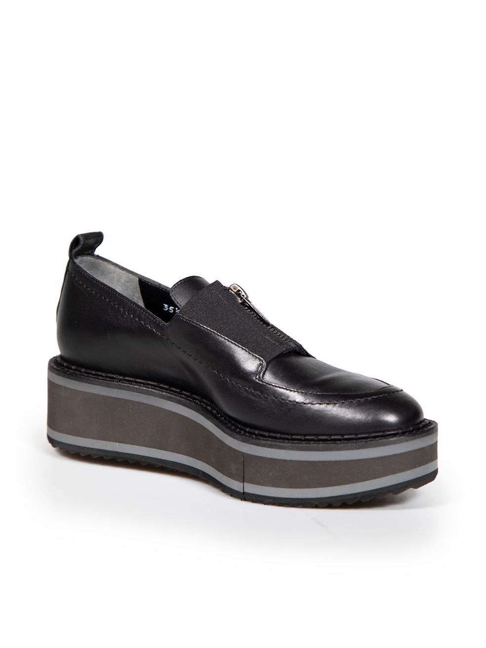 CONDITION is Never worn. No visible wear to shoes is evident on this new Clergerie designer resale item. Please note that the cut in the platform is deliberate.
 
 
 
 Details
 
 
 Black
 
 Leather
 
 Loafers
 
 Platform
 
 Round toe
 
 Front zip