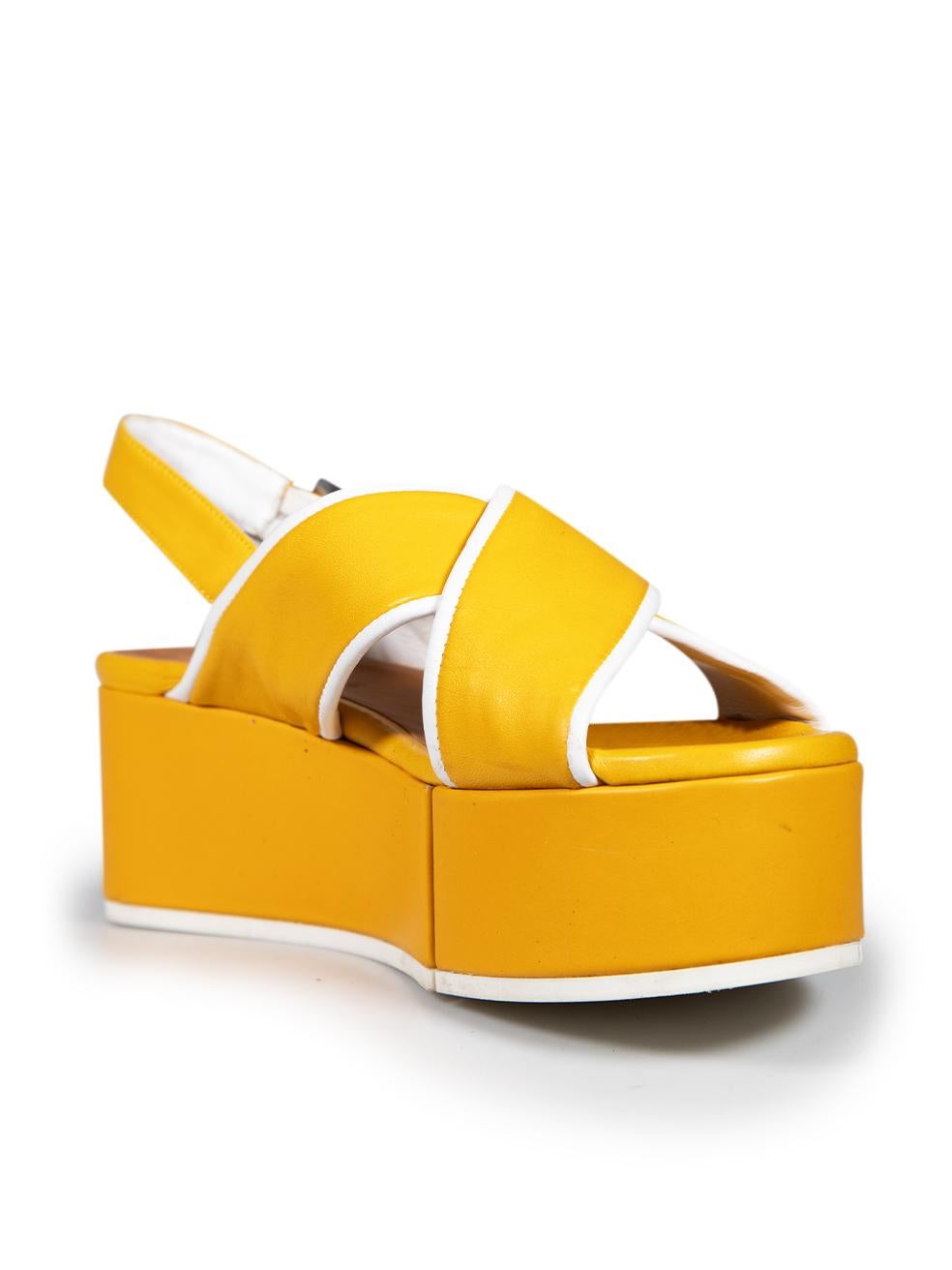 CONDITION is Very good. Minimal wear to the sandals is evident. Abrasion around the rim of the platform and across the toe strap on both shoes on this used Clergerie designer resale item.
 
 Details
 
 
 Yellow
 
 Leather
 
 Sandals
 
 Slingback
 
