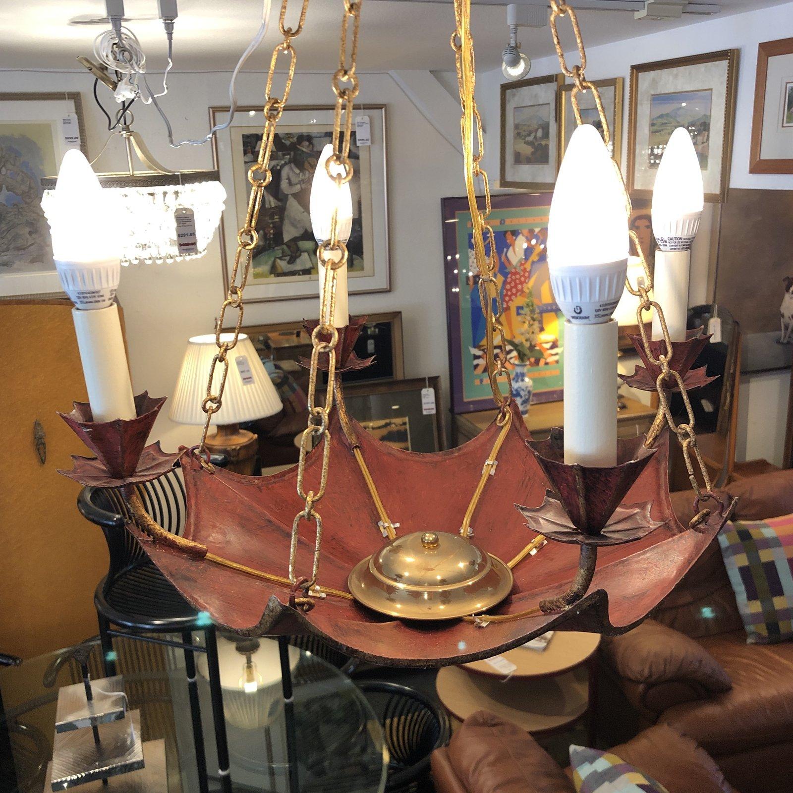 The Clermont chandelier by Vaughan. The red and gold toile light is whimsical and charming. Six lights glow above the canopy.


