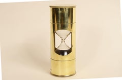 Brass sand hourglass with circular base and blown glass cruet 1930s