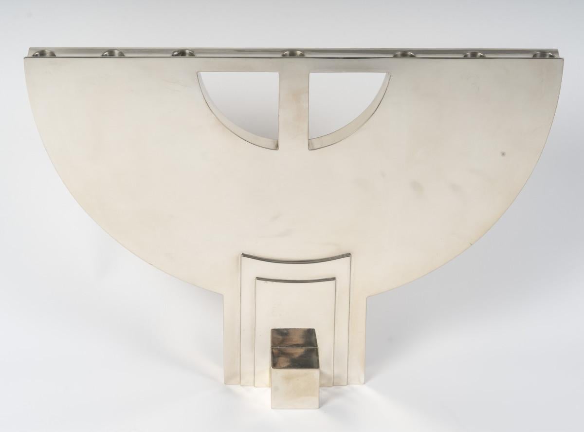 Modernist seven-candle solid silver candlestick by Hans Hollein for Cleto Munari. This piece illustrates the avant-garde spirit of 1970s Italian design. It is both an everyday object and a contemporary art object. It was designed in 1979 and