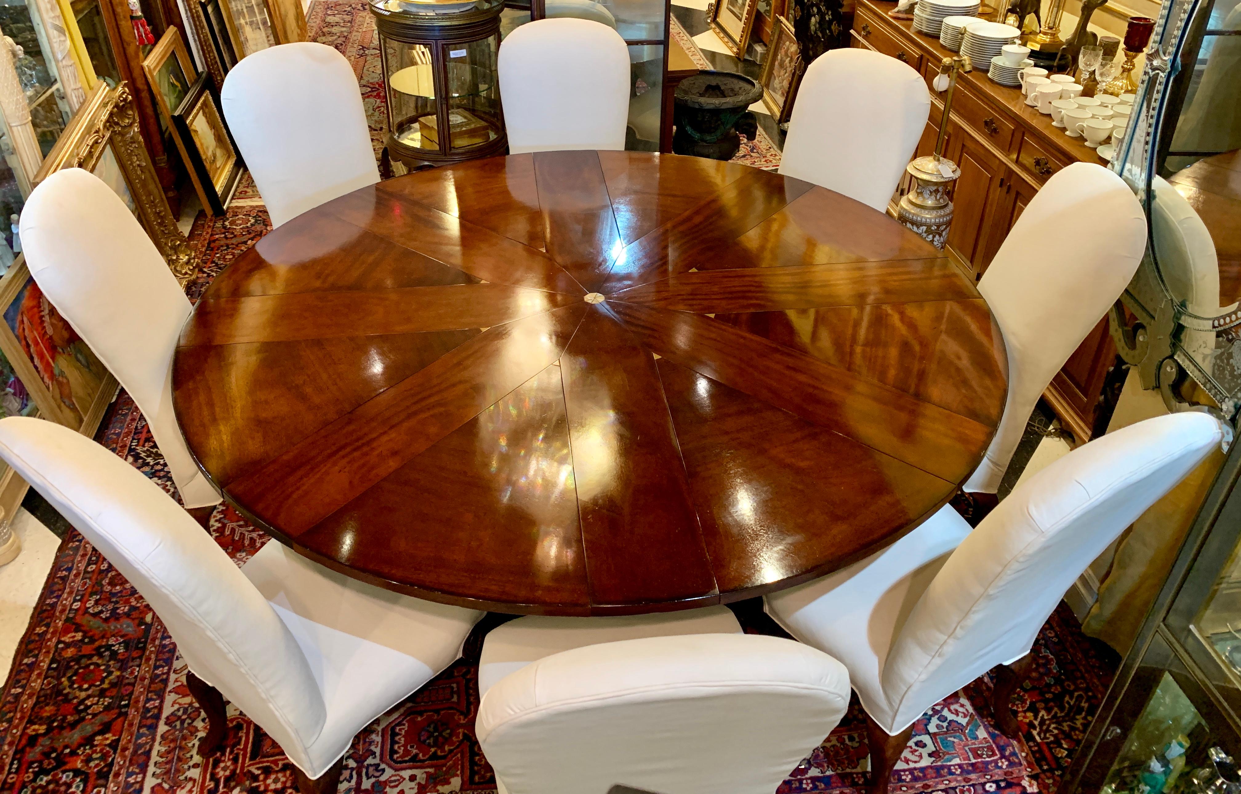 Couture designer Oscar De La Renta for Century Furniture Company dining set includes a handcrafted, distressed mahogany finish, Oscar De La Renta Star Pattern radial expansion round dining table, 8 matching Oscar De La Renta high back upholstered