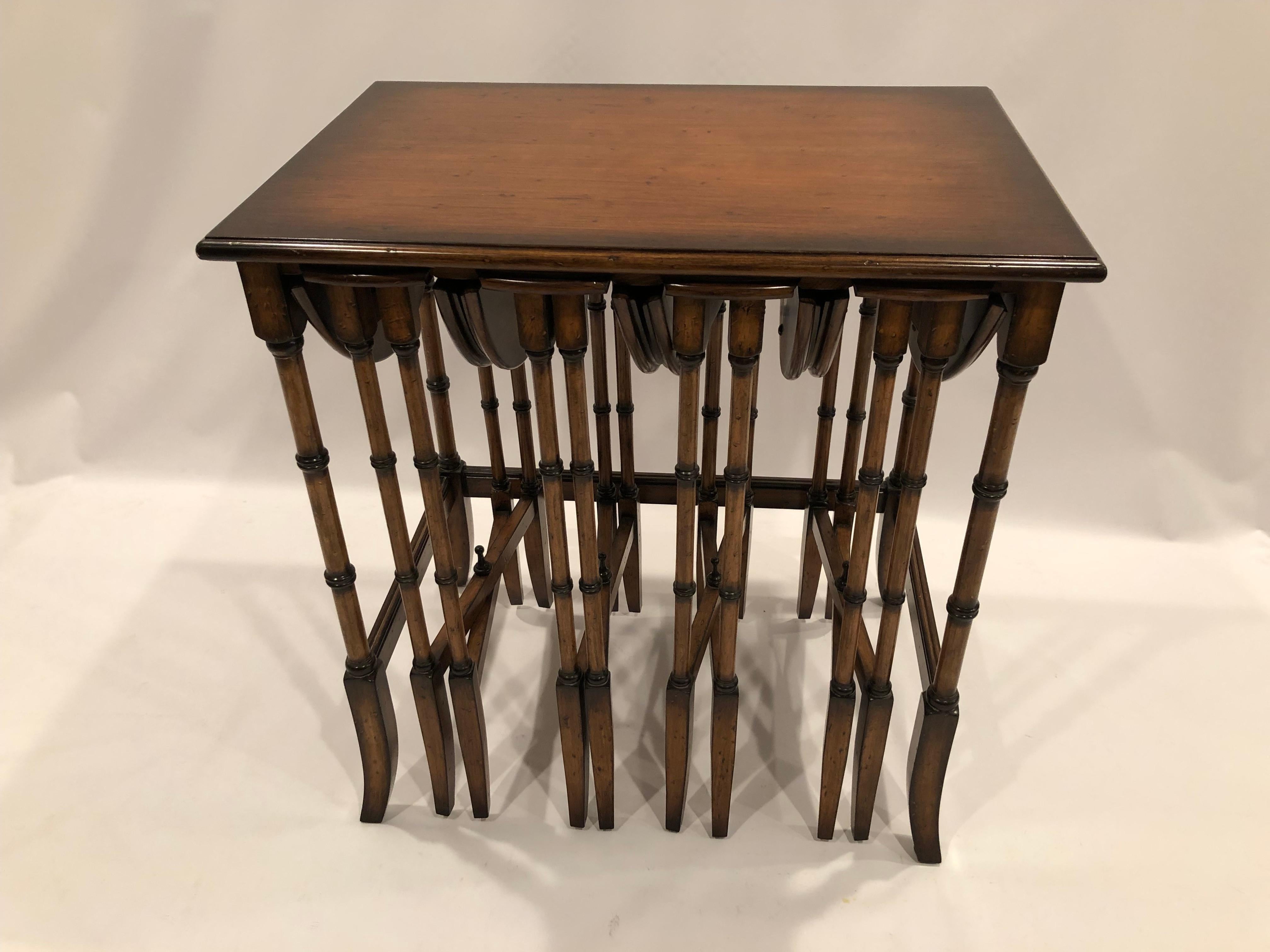 Beautifully made versatile set of walnut nesting tables having a single rectangular table with clever space for 4 smaller tables to slide under like plates in a plate rack. Each hidden table has drop leaves that open to make 4 lovely round tables