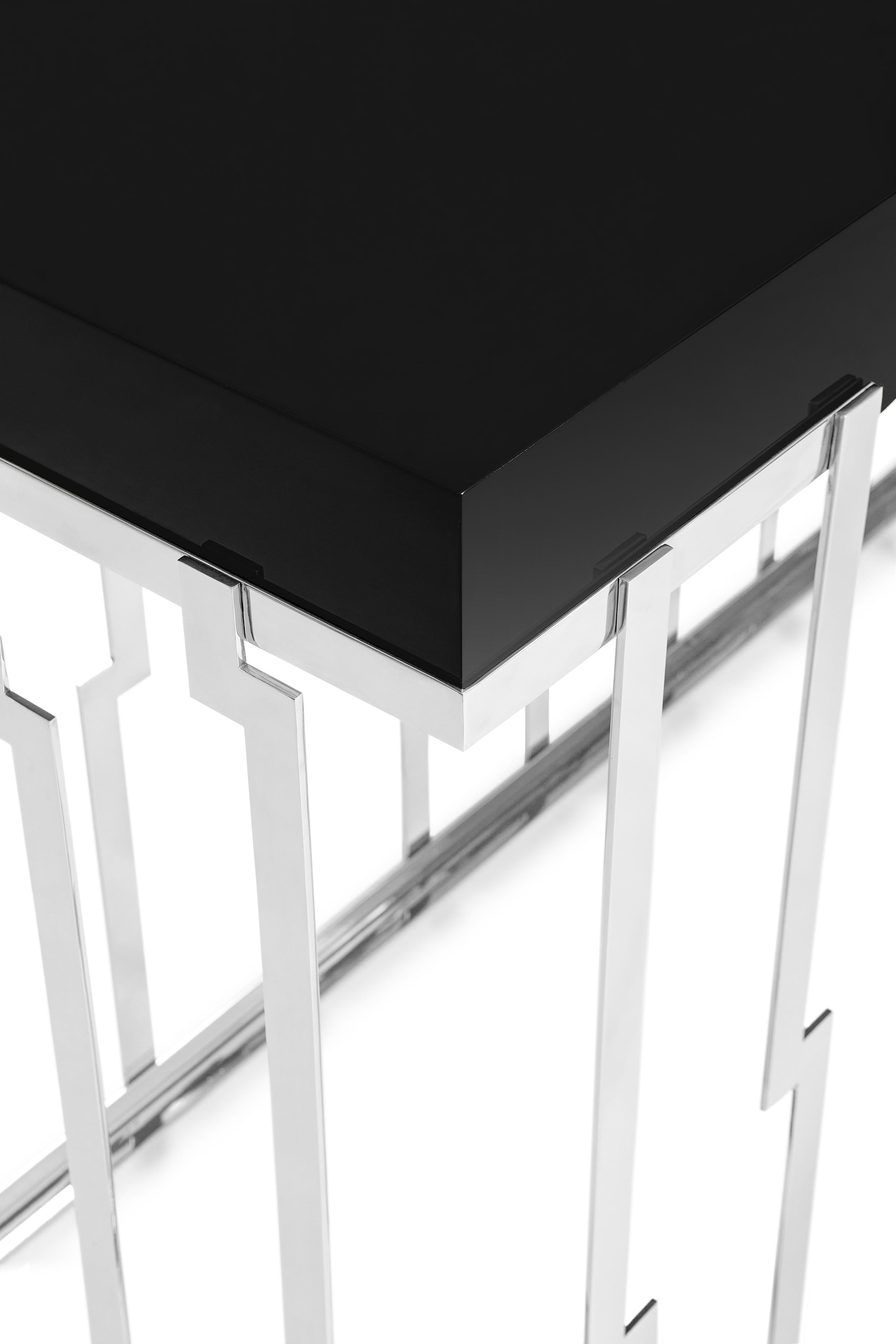 Cliff Console by Ginger & Jagger
Dimensions: D 51 x W 183 x H 87 cm. 
Materials: Stainless steel and lacquer.
Finish: Top lacquered in Night Jungle in gloss; base in stainless steel in Nickel in Polished finishing.

This product is suitable for