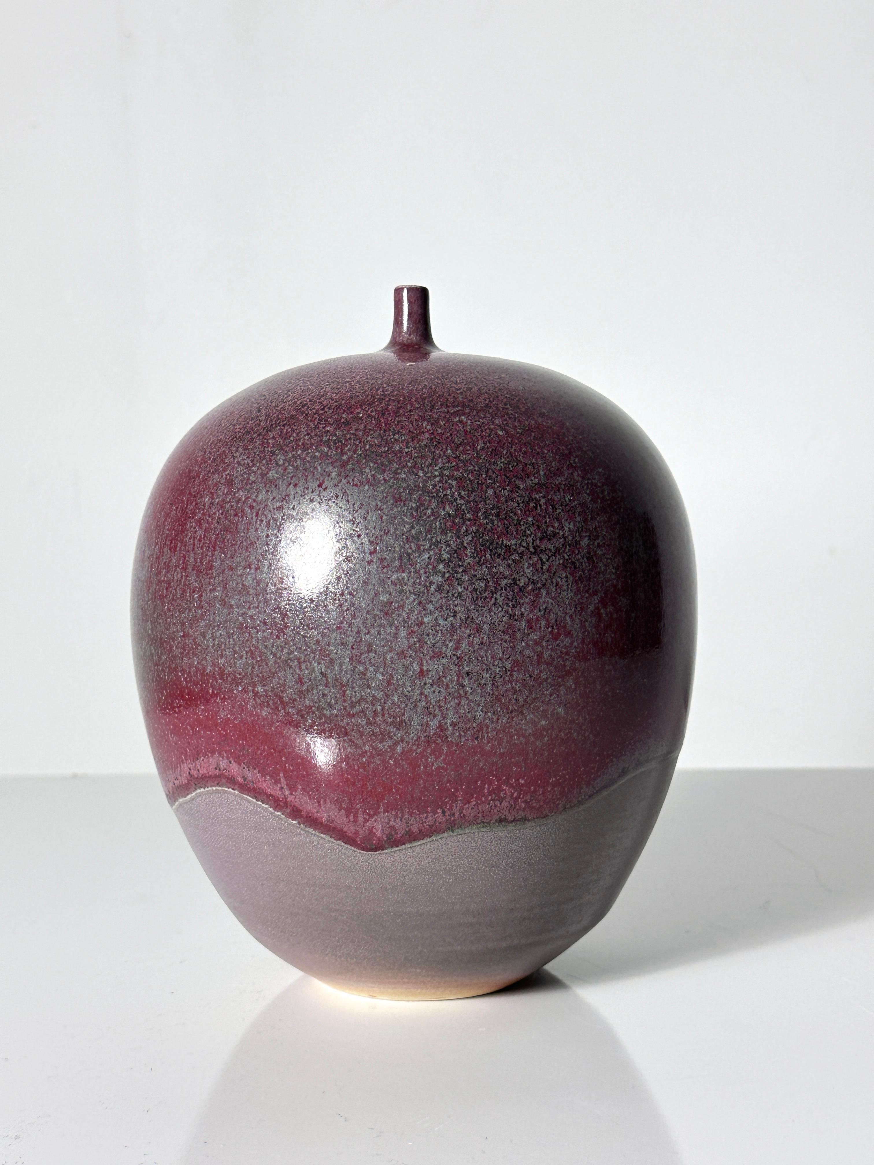 Teardrop porcelain vase by Cliff Lee USA 1994
Oxblood flambé glaze in uncommon drip design over a lower matte finish
Signed to underside and dated

From the estate of John Glick, thence by descent

7