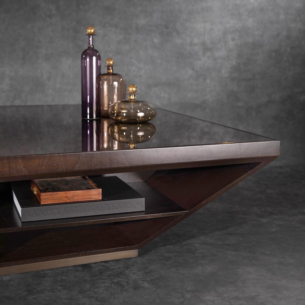 CY Cantilevered cocktail table portrays a dynamic balance on the substantial scale. Hand-crafted Dark Stained Walnut and Darkened Bronze Base with a Bronze Mirrored Glass Tabletop Insert is a creation of CY design team. This beautiful modern style