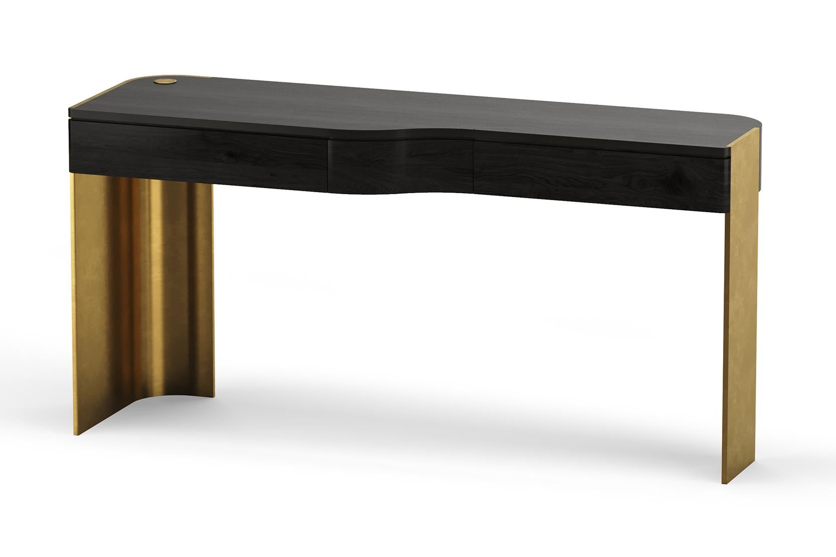 Izzy Desk, constructed with curved drawer modules, it combines the coolness of the asymmetrical metal base with the warmth of richly grained wood tabletop with built-in wireless charging & integrated power outlets. Custom sizes and finishes