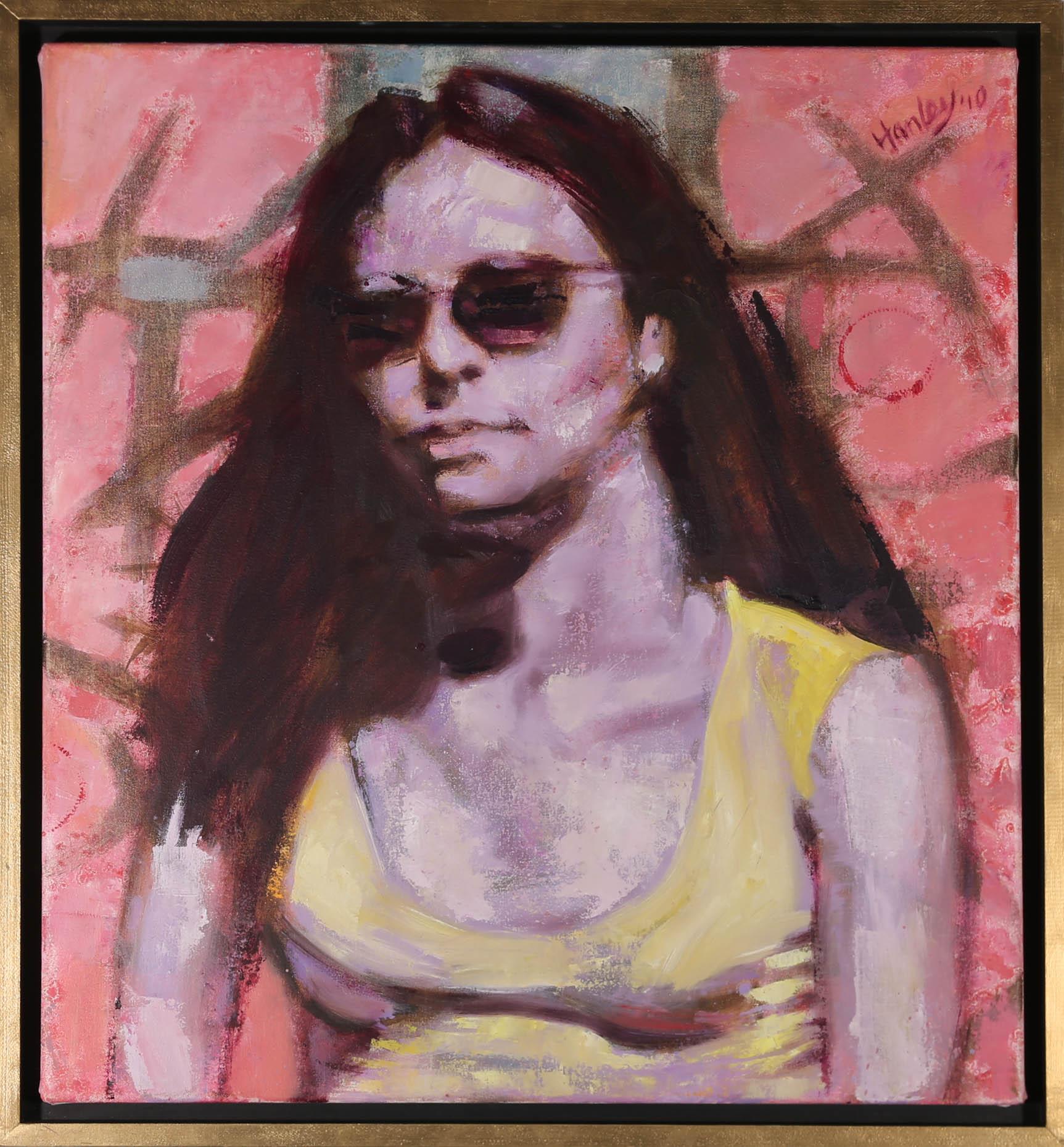 This modernist oil portrait depicts a striking female figure, face on, wearing a yellow t-shirt and shades. Signed and dated to the upper right-hand corner. Float mounted in a gold painted box frame. On canvas on stretchers.