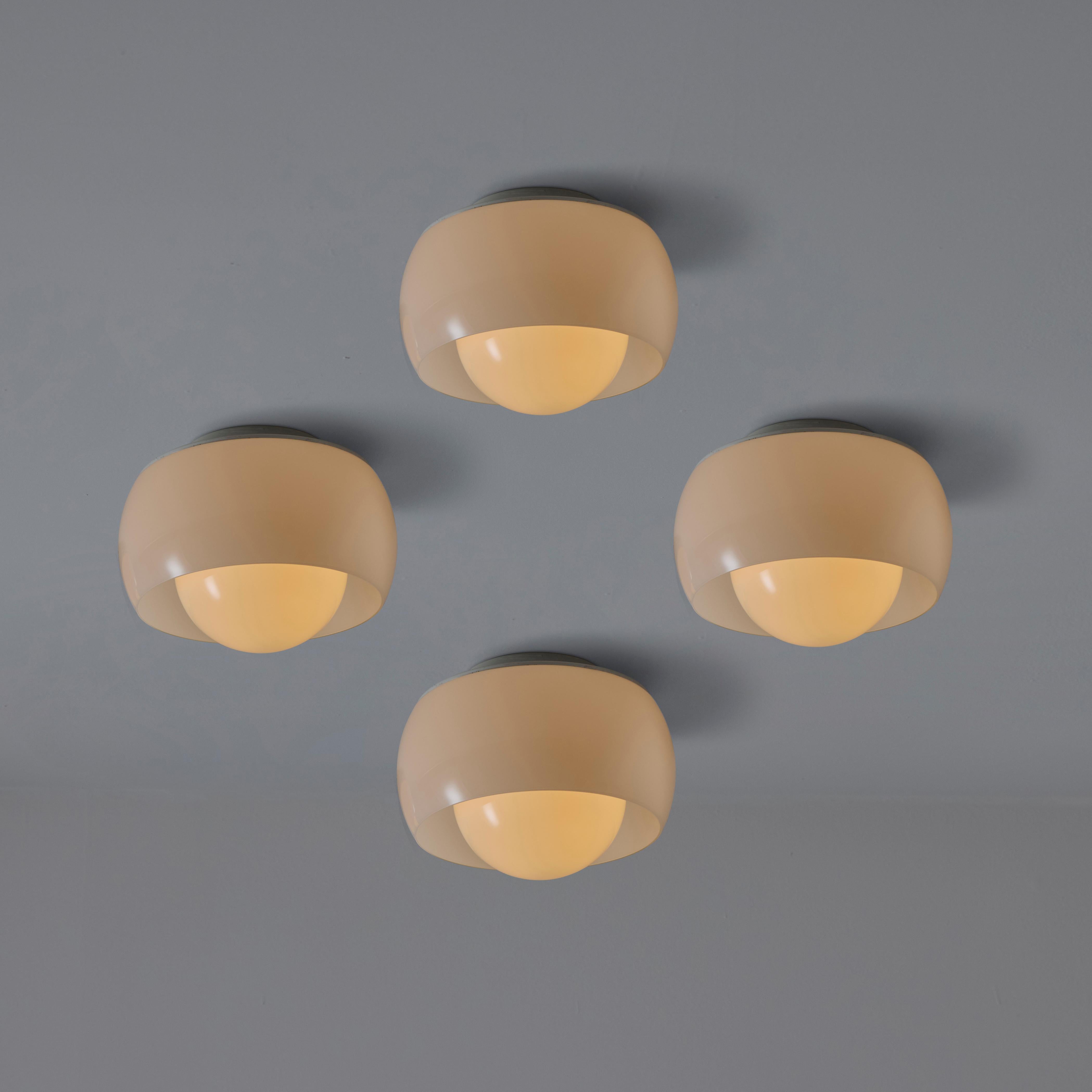 Clinio Flush Mounts Ceiling Light by Vico Magistretti for Artemide. Designed and manufactured in Italy circa 1960's. Opaline glass outer and inner diffusers. Enameled metal frame. Rewired for U.S. standards. Holds a single E27 socket type, adapted