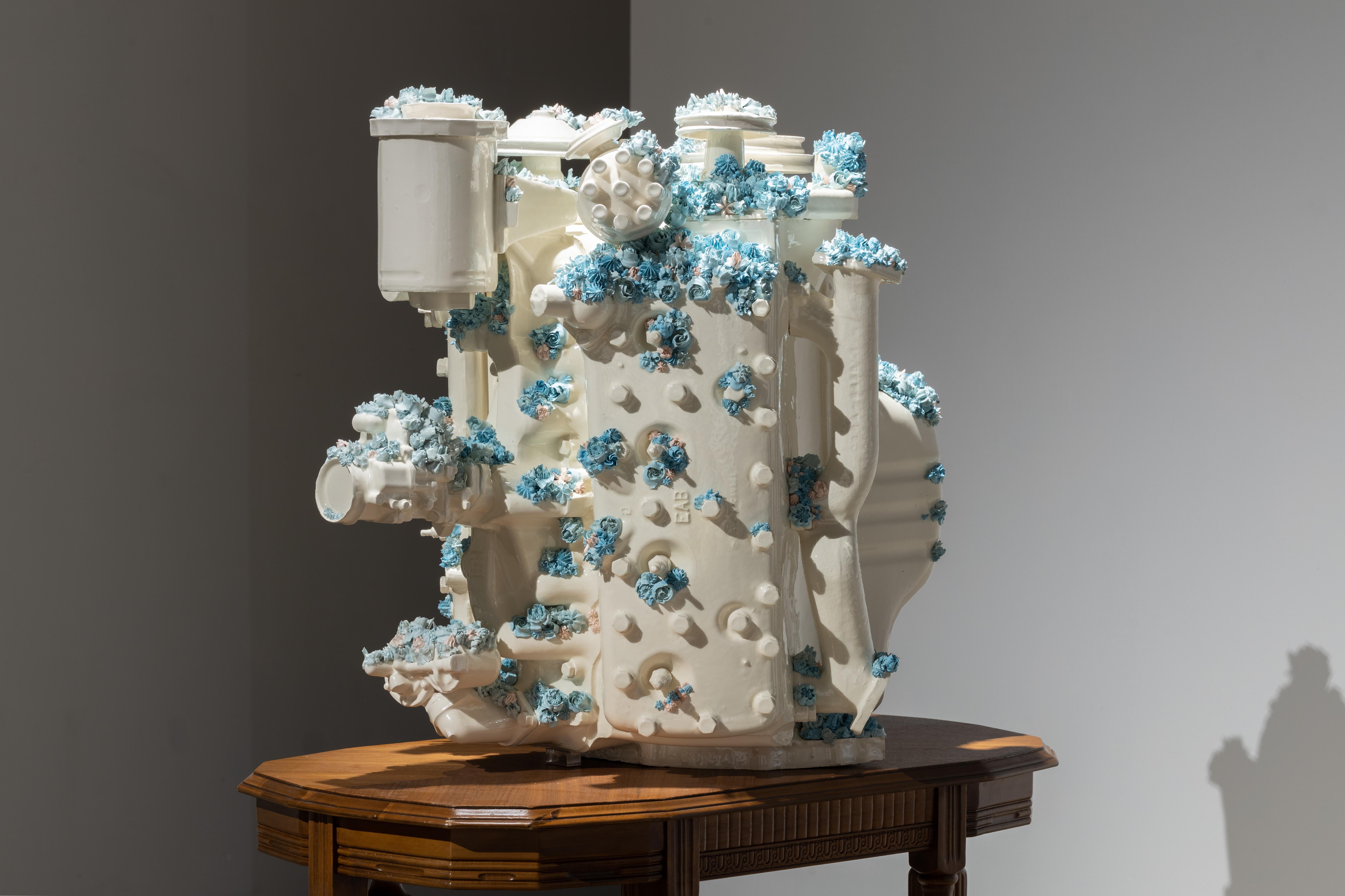 Clint Neufeld Figurative Sculpture - Engine with blue flowers