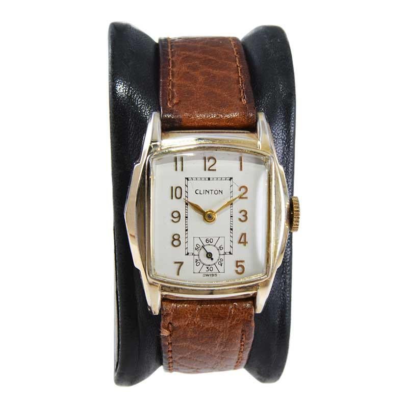 FACTORY / HOUSE: Clinton Watch Company
STYLE / REFERENCE: Modified Cushion
METAL / MATERIAL: Yellow Gold Filled 
CIRCA / YEAR: 1940's
DIMENSIONS / SIZE: Length 35mm x Width 28mm
MOVEMENT / CALIBER: Manual Winding / 7 Jewels 
DIAL / HANDS: Original