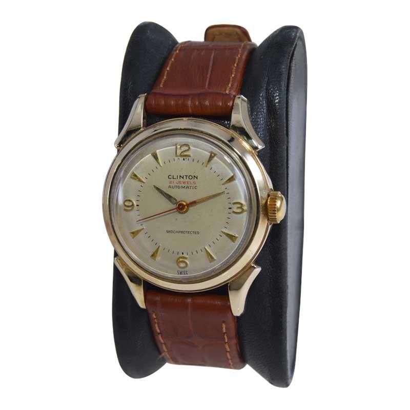 FACTORY / HOUSE: Clinton Watch Company
STYLE / REFERENCE: Round Art Deco 
METAL / MATERIAL: Yellow Gold Filled
CIRCA / YEAR: 1940's
DIMENSIONS / SIZE: Length 39mm X Diameter 31mm
MOVEMENT / CALIBER: Automatic Winding / 21 Jewels 
DIAL / HANDS: