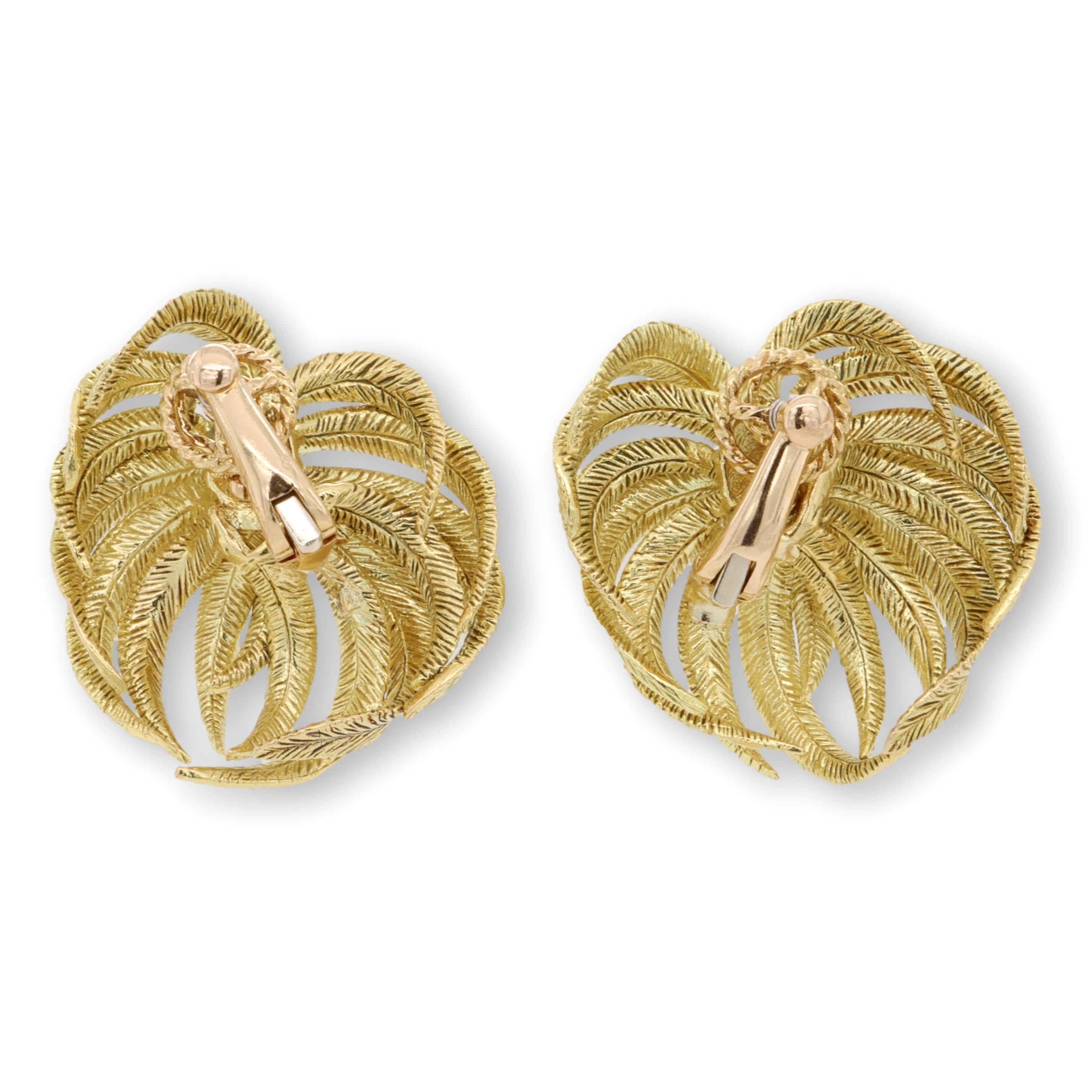 Vintage pair of beautifully hand made ear-clips finely crafted in 18 Karat yellow gold with a Palm Leaf Motif. The leaves have a fluted textured finish and the earrings have large handmade omega clip backs. The earrings have a nice heft and date